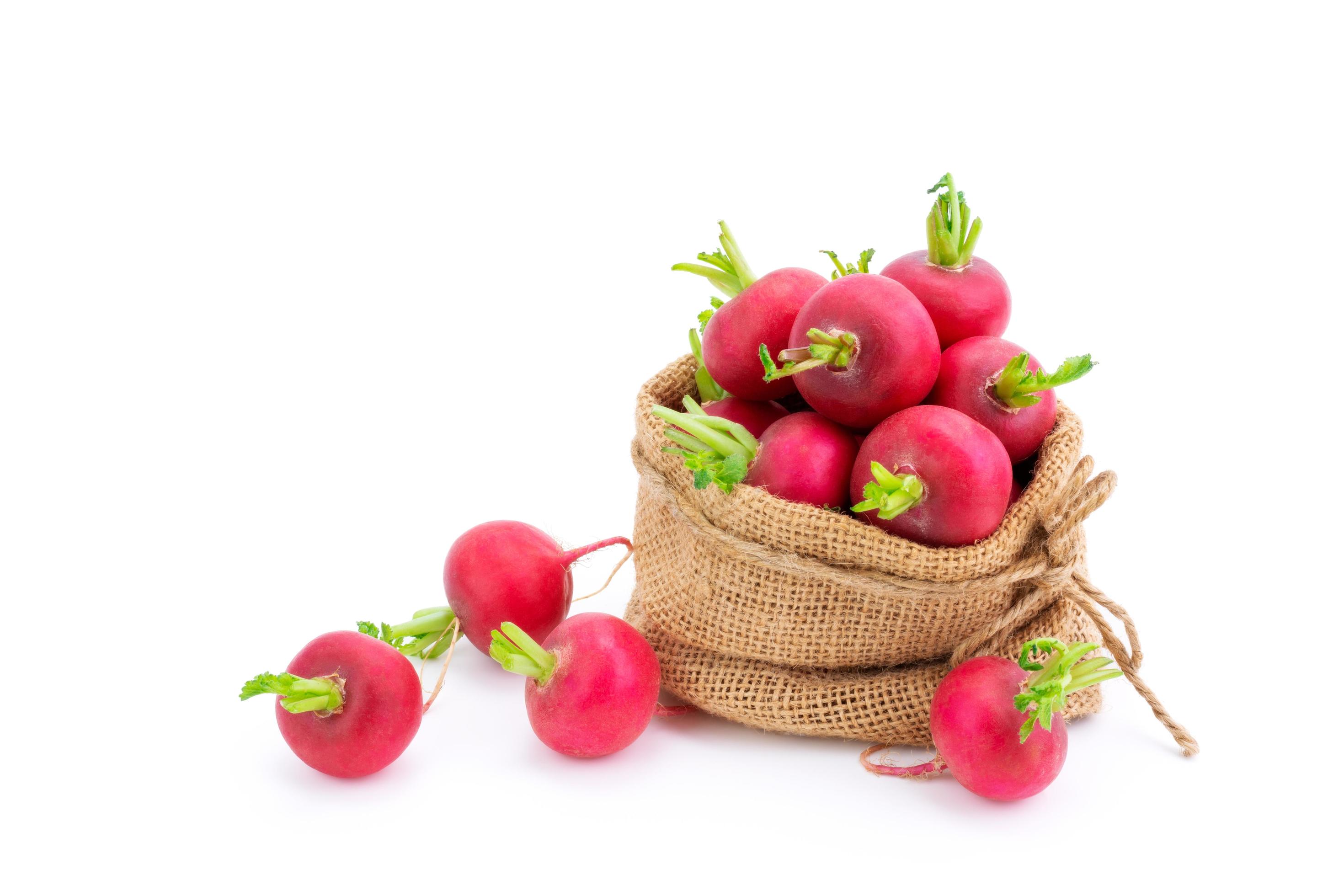 Red or purple radish in burlap bags Organic vegetable salad mix of healthy natural food isolated on white background. Stock Free