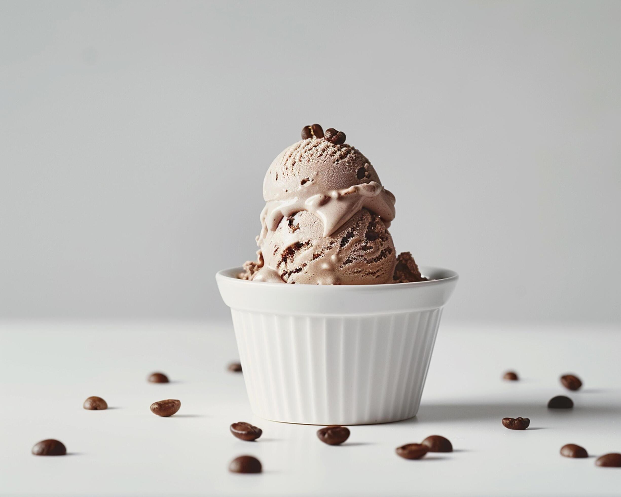 A scoop of ice cream in a white bowl with coffee beans Stock Free