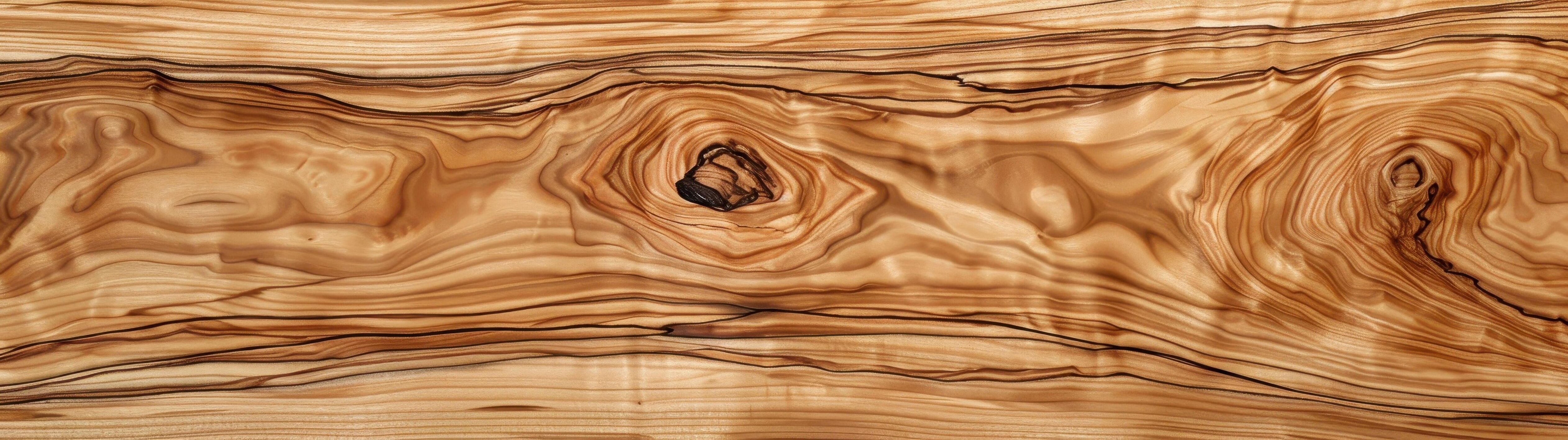 An olivewood wood grain background showcases rich, swirling patterns and warm, earthy tones Stock Free