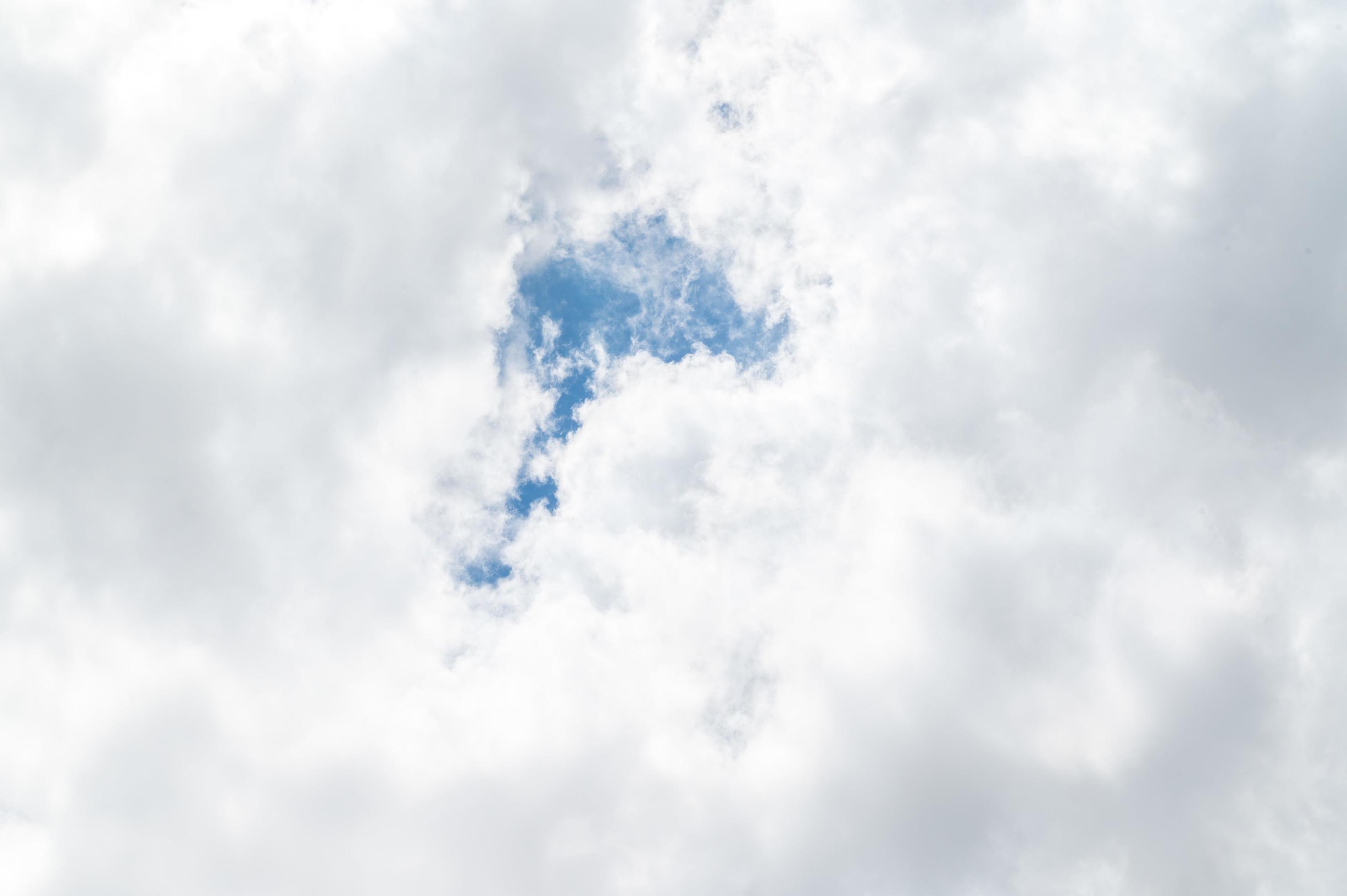 Beautiful white fluffy clouds in blue sky. Nature background from white clouds in sunny day Stock Free