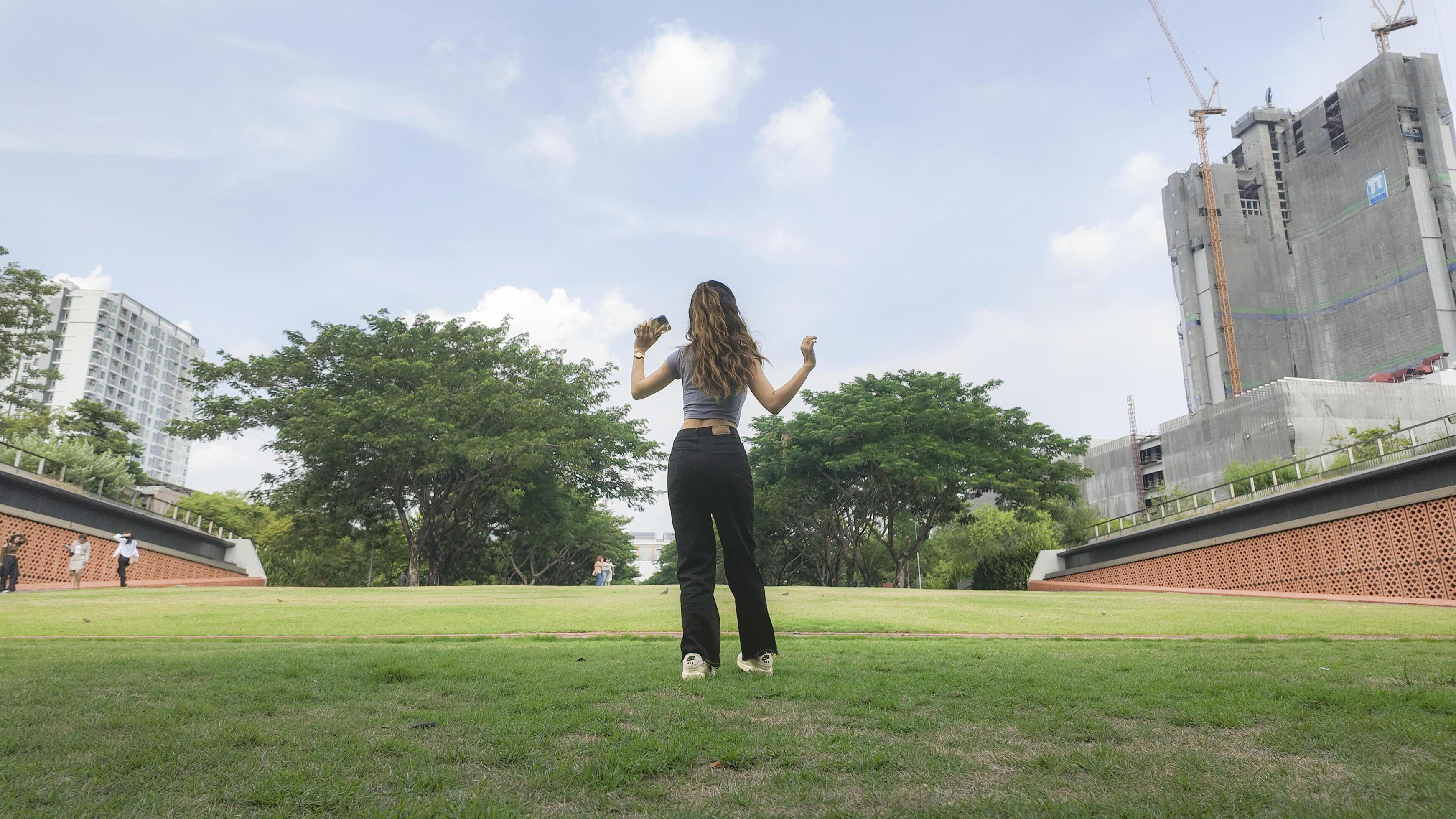 Asian women do freestyle hip hop and breakdancing in a public space in the middle of the city. With a cheerful and happy attitude Stock Free