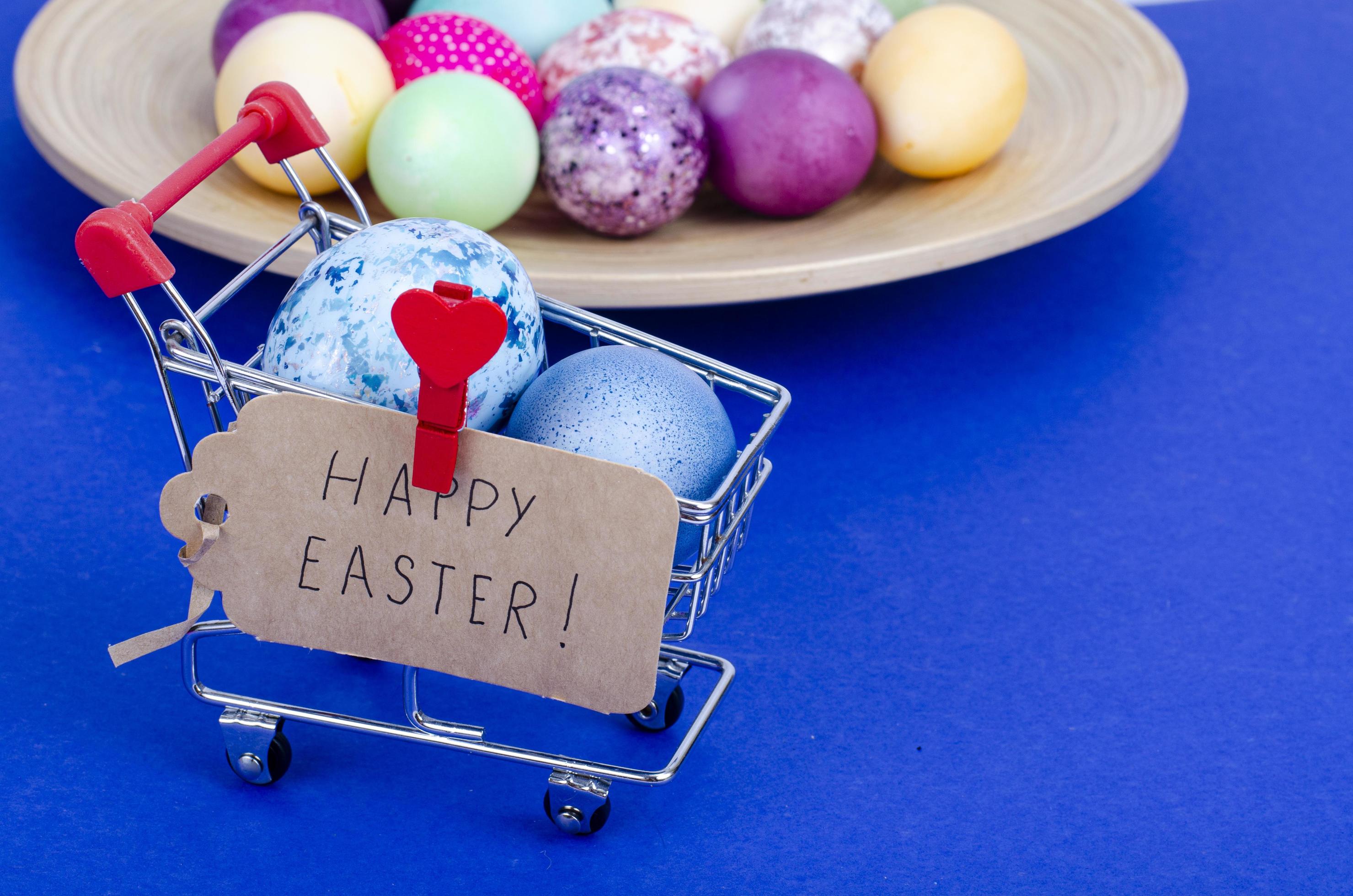 Grocery supermarket cart filled with chicken eggs. Concept of preparing for Easter, buying food. Space for text. Studio Photo Stock Free