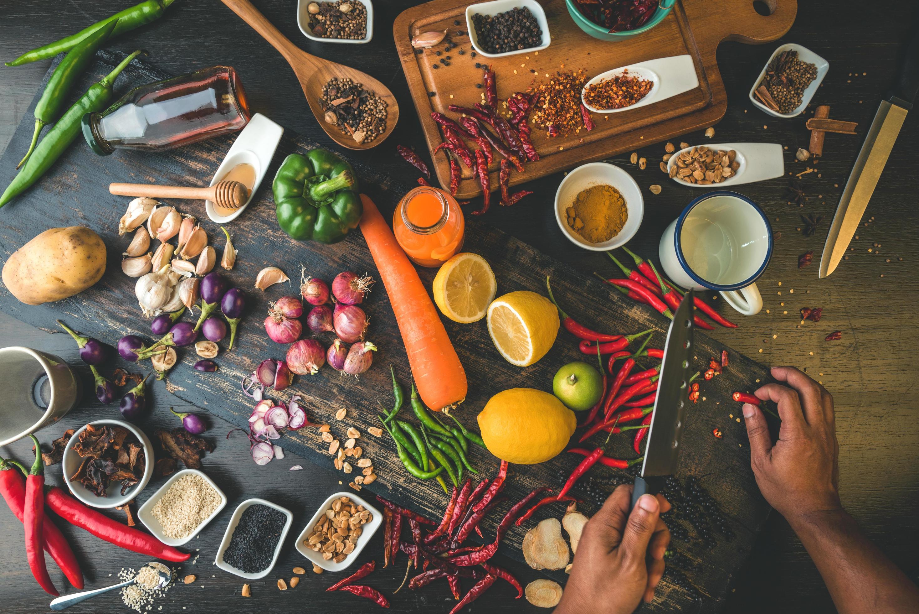 Healthy food herbs Spices for use as cooking ingredients on a wooden background with Fresh organic vegetables on wood. cooking food. Stock Free