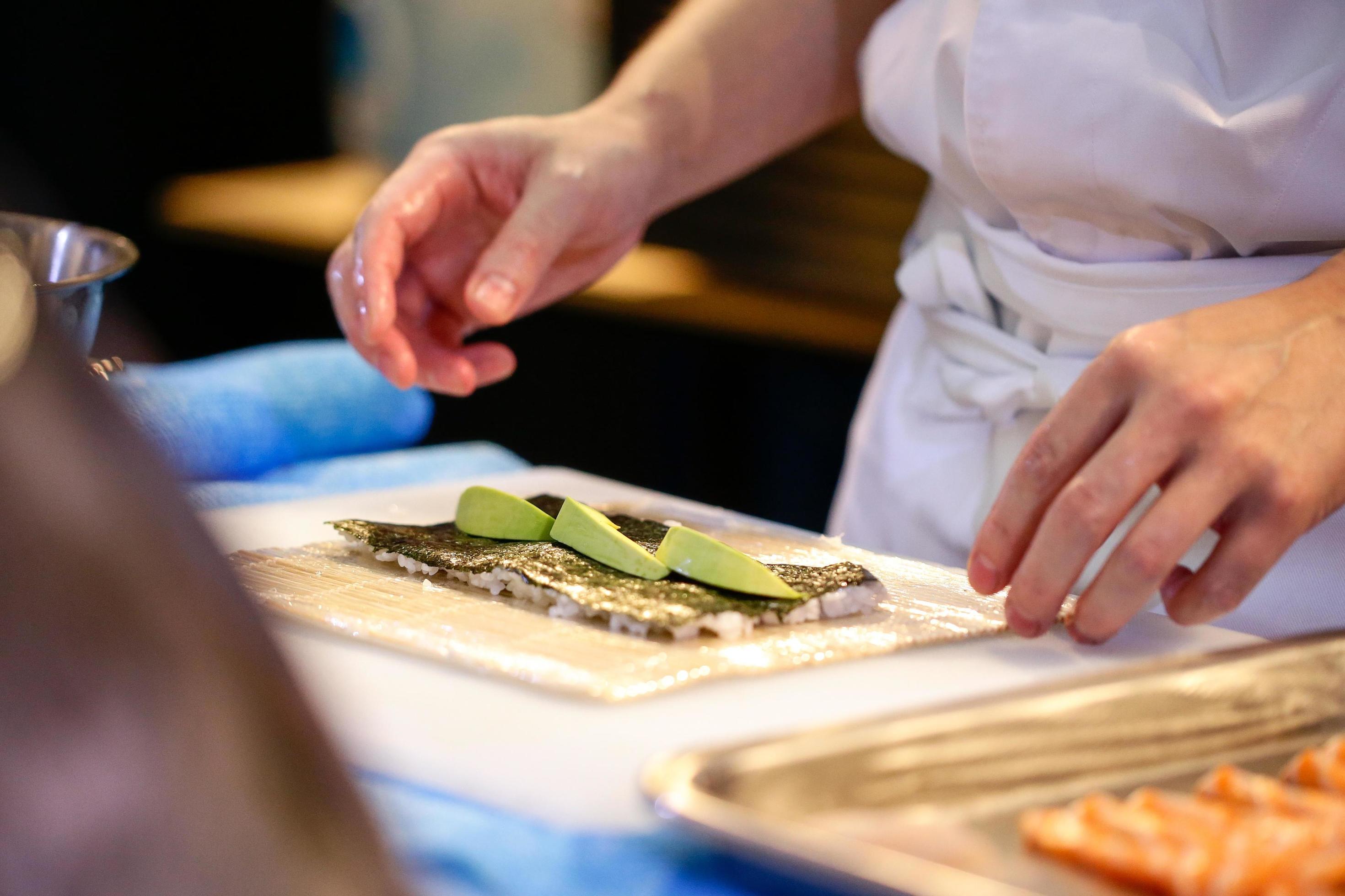 chef hands preparing japanese food, chef making sushi Stock Free