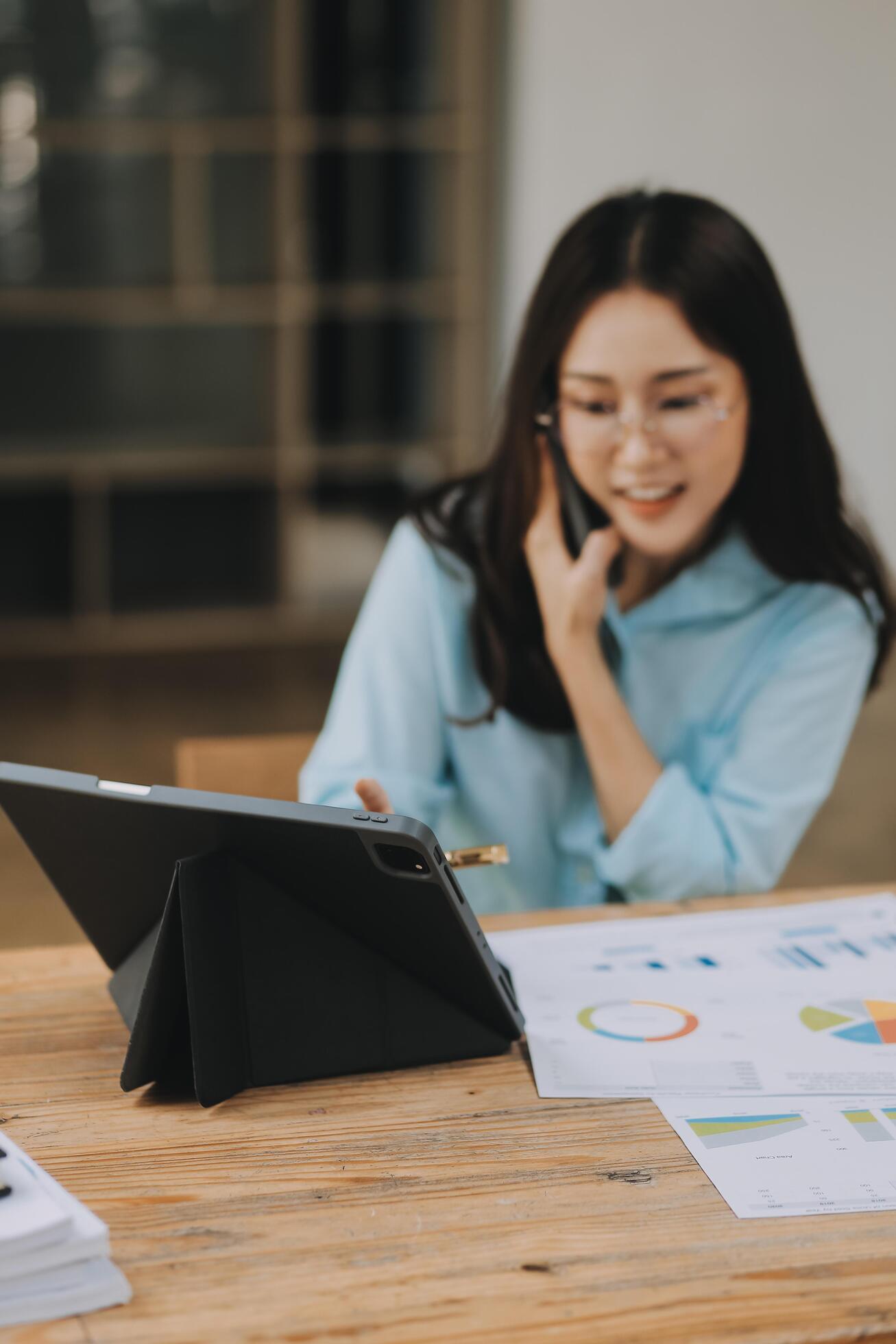 Asian woman working at the office. woman using laptop computer on desk at office Stock Free