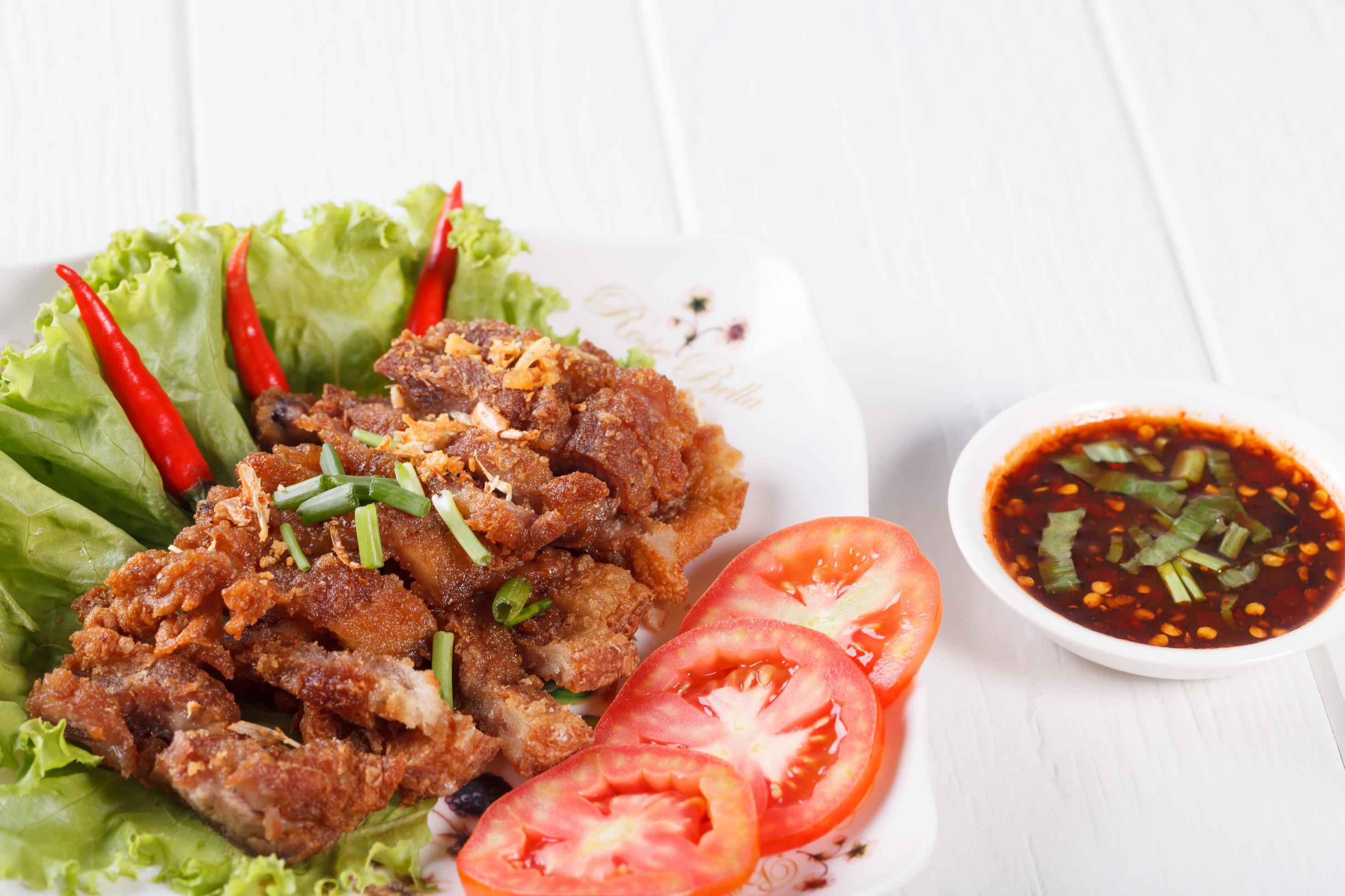 streaky pork fried with spicy dipping sauce, Thai food Stock Free