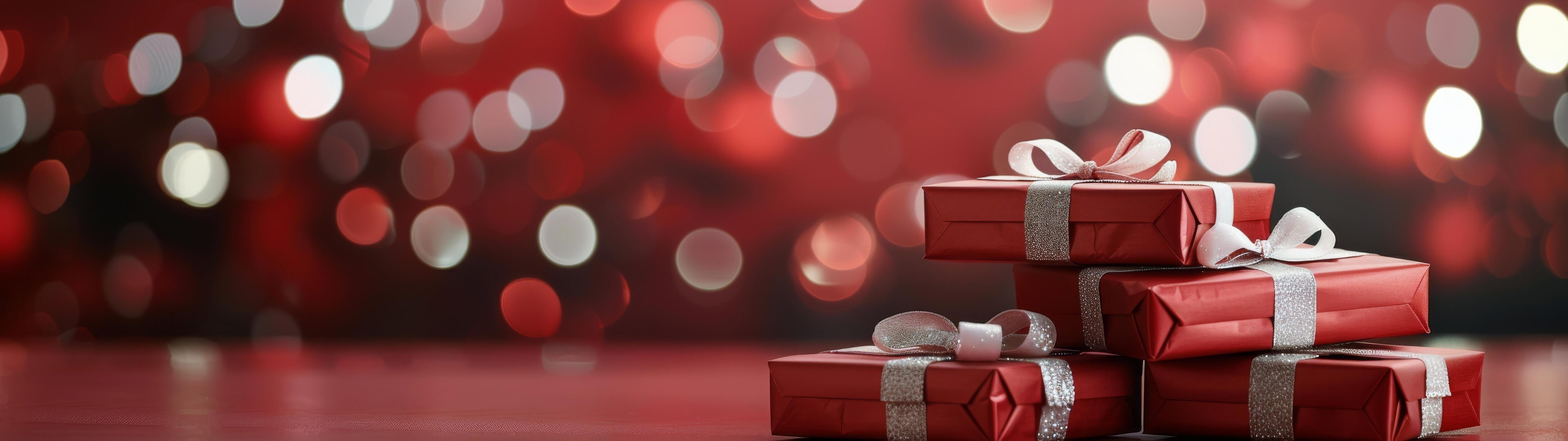 Festive Red Presents Wrapped With Silver Ribbon and Bokeh Background Stock Free