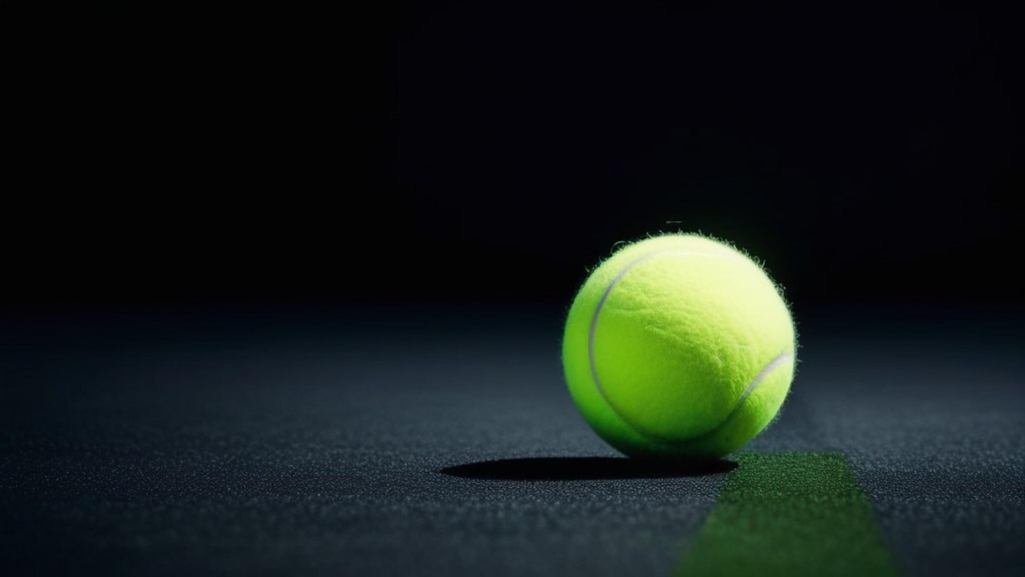 tennis ball on the dark background with copy space for text Stock Free