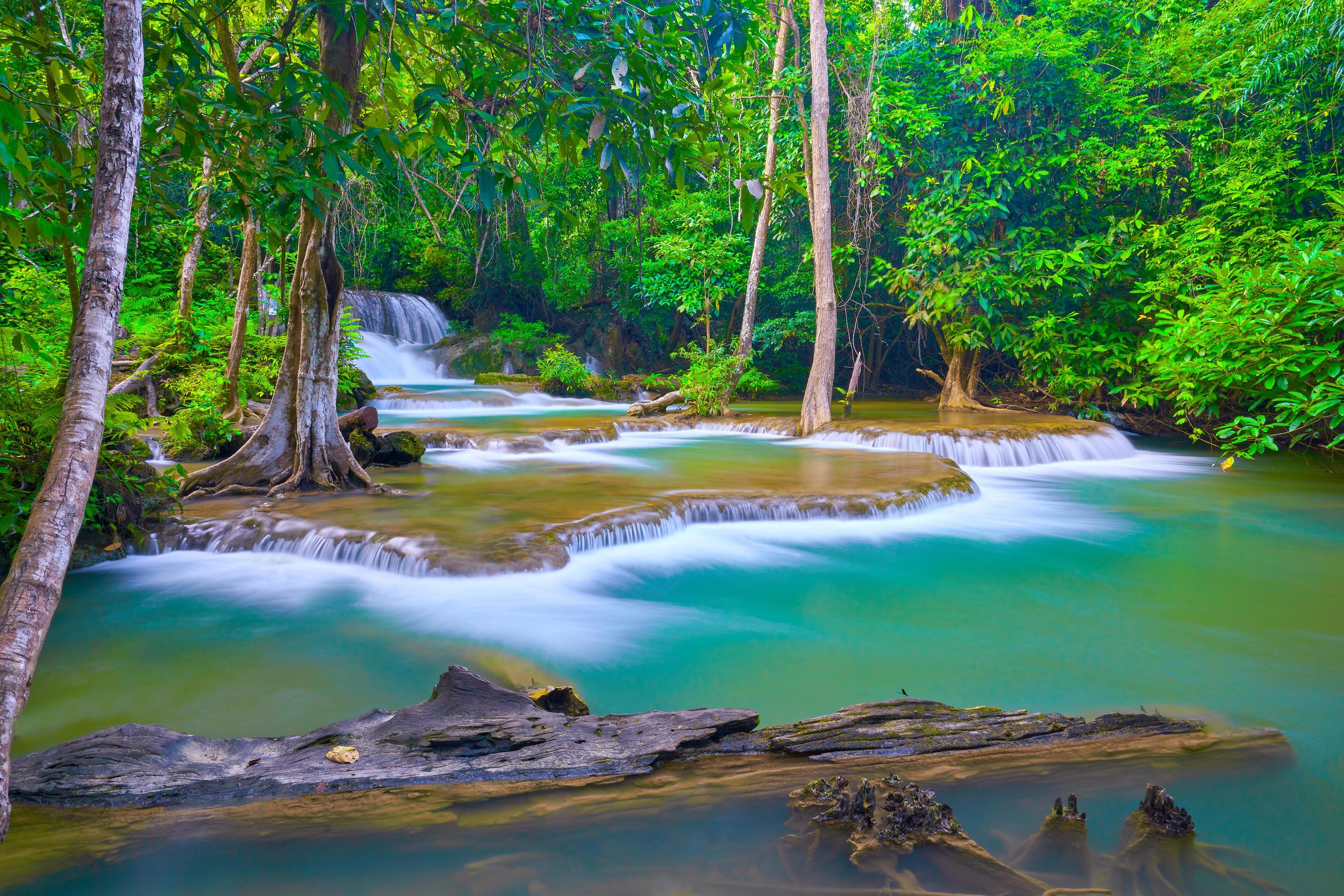 the great waterfall in Thailand, the Onsen atmosphere. beautiful deep forest waterfall in Thailand. Stock Free