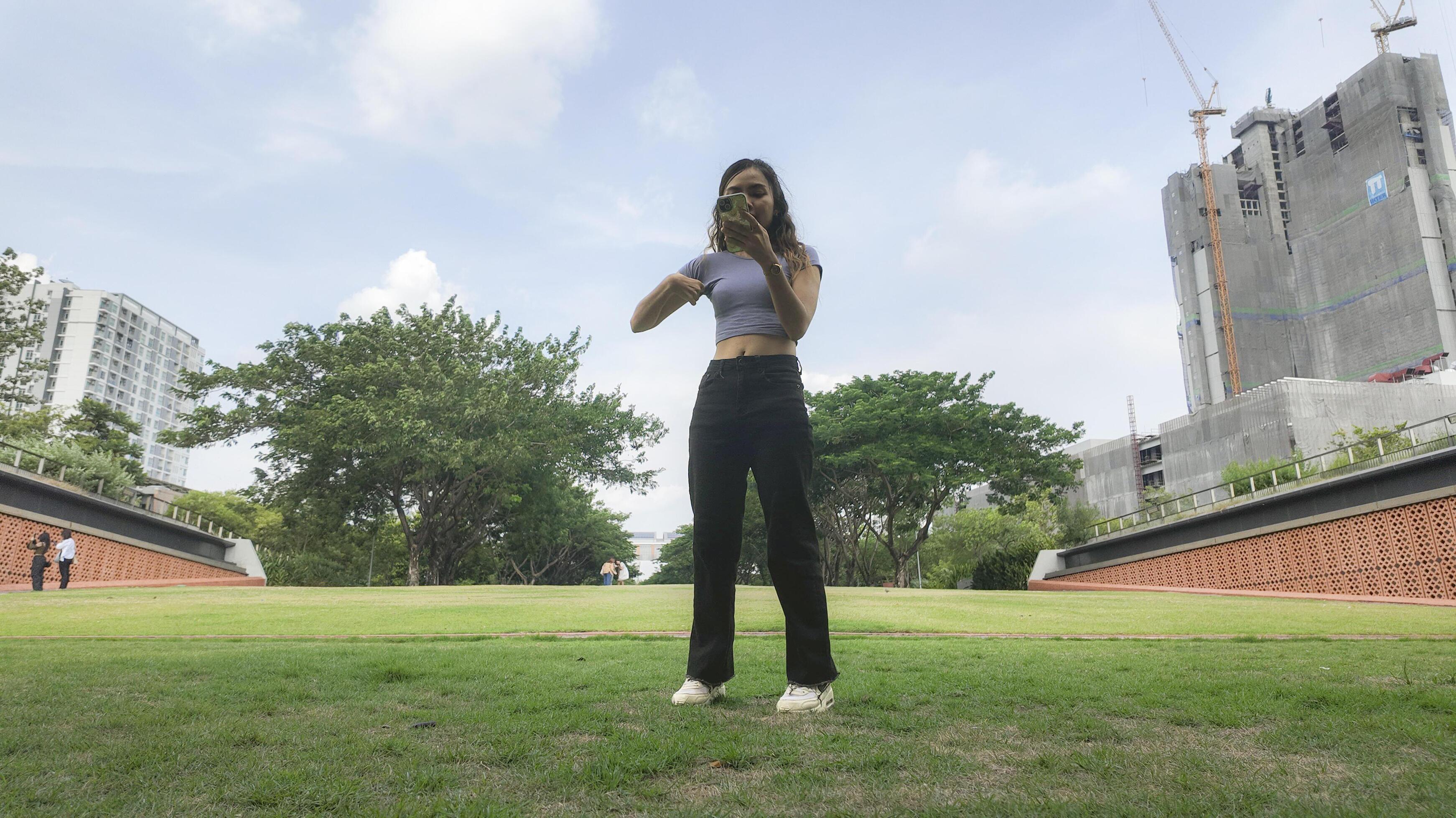 Asian women do freestyle hip hop and breakdancing in a public space in the middle of the city. With a cheerful and happy attitude Stock Free