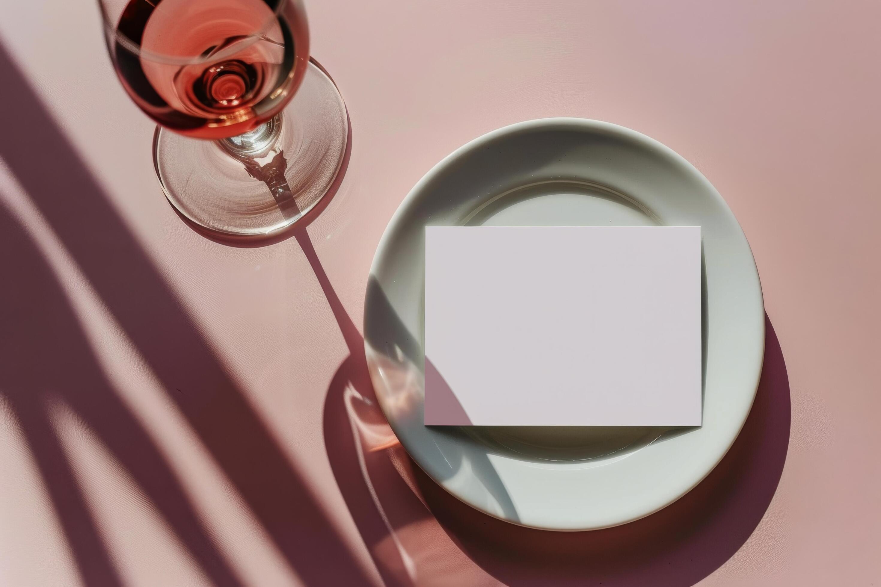 Glass of Water and White Card on Plate With Palm Leaf Shadows Stock Free