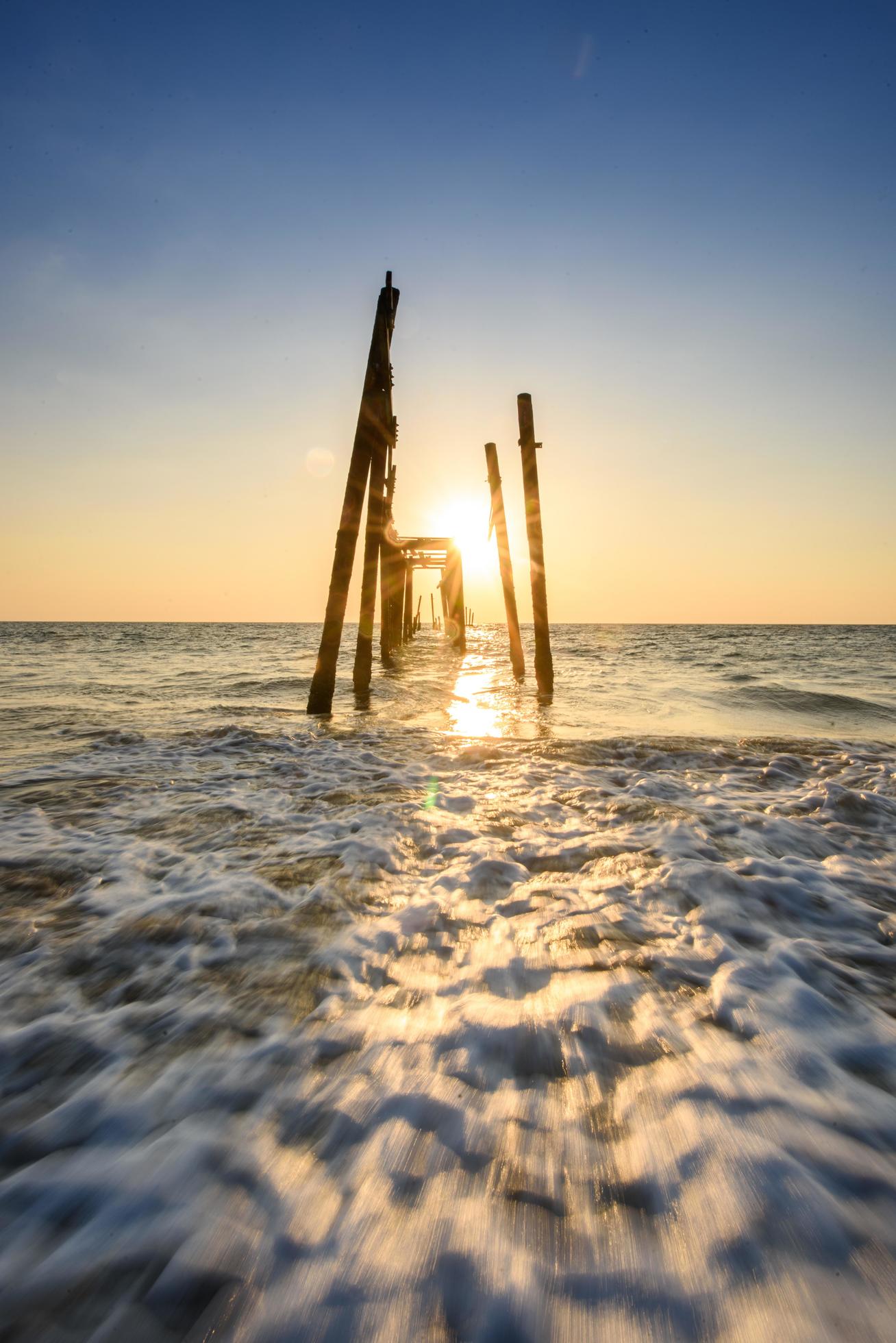 broken wooden bridge sunset on the sea at Phangnga, Thailand Stock Free