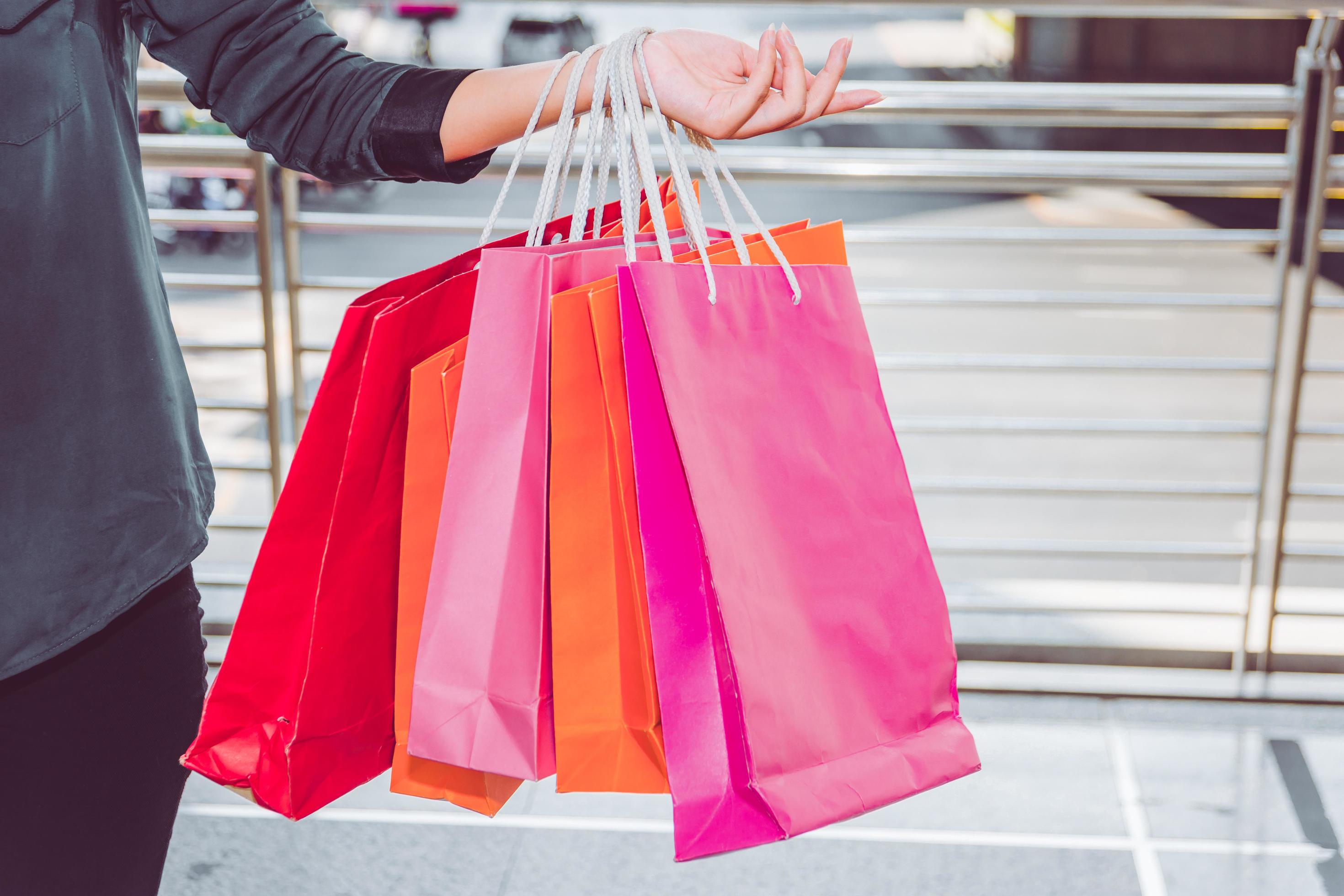 Happy woman with shopping bags enjoying in shopping. women shopping, lifestyle concept Stock Free