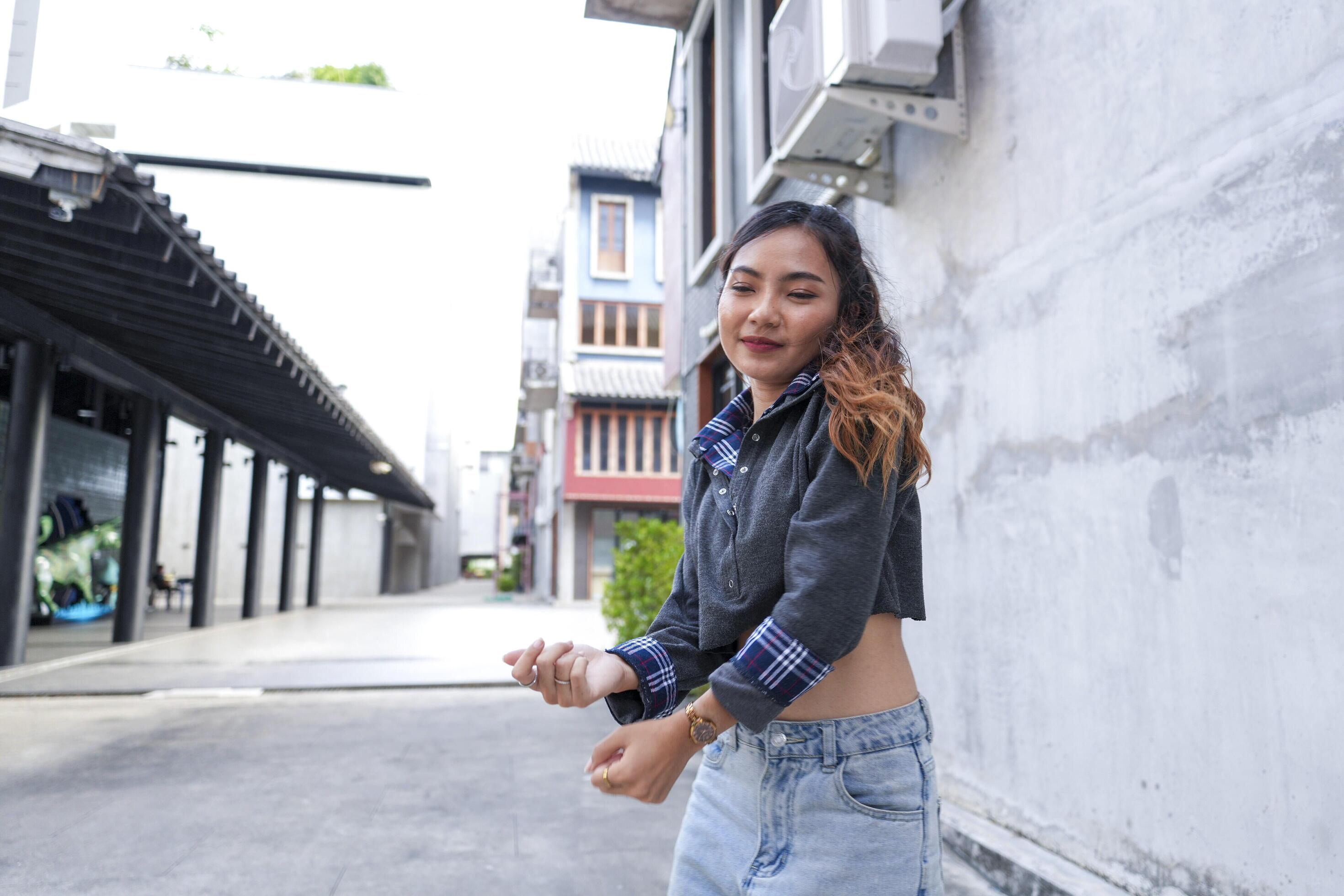 
									Asian women do freestyle hip hop and breakdancing in a public space in the middle of the city. With a cheerful and happy attitude Stock Free