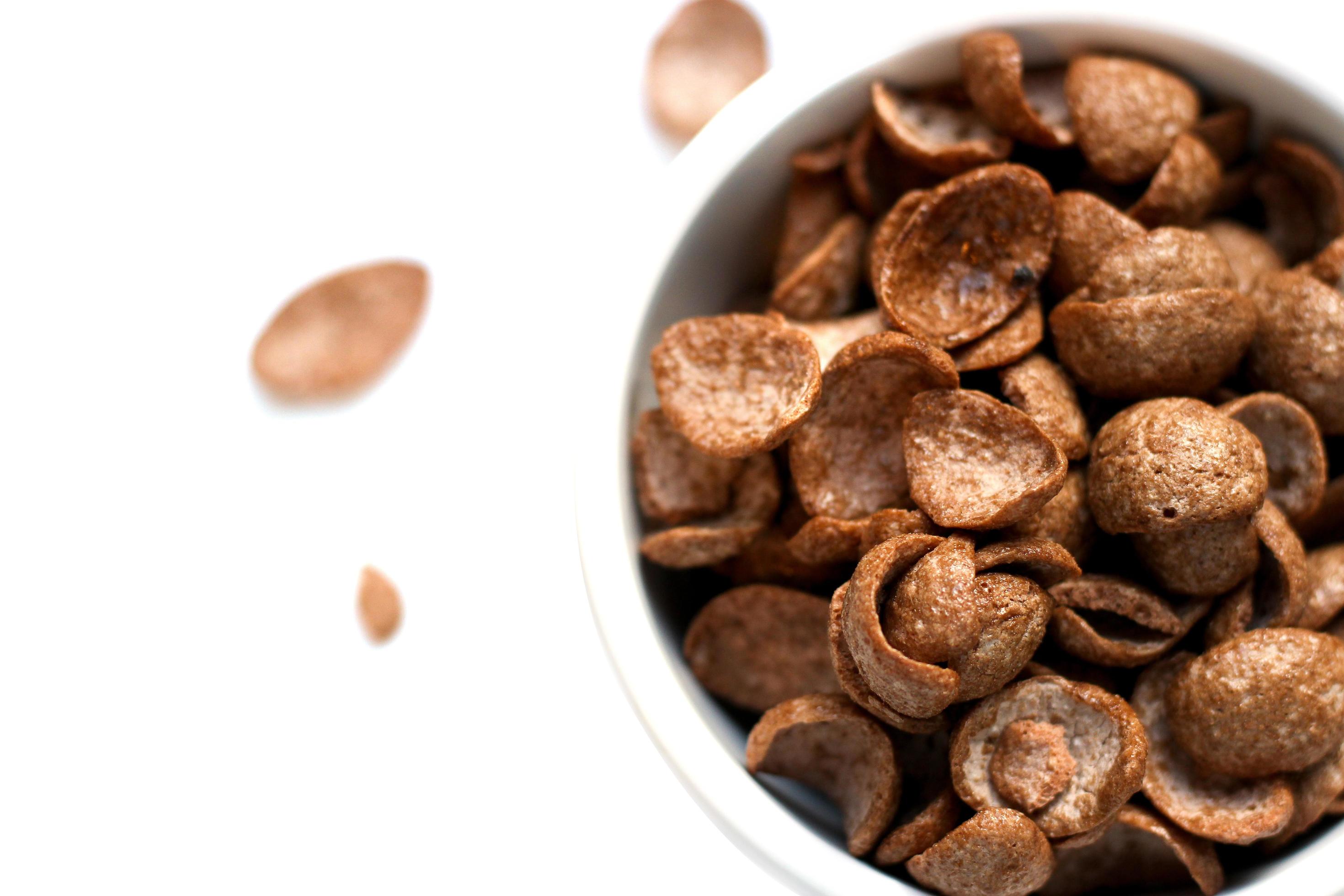 Cereal chocolate flavor in whith bowl, breakfast ready to eat in the morning, food isolated on white background Stock Free