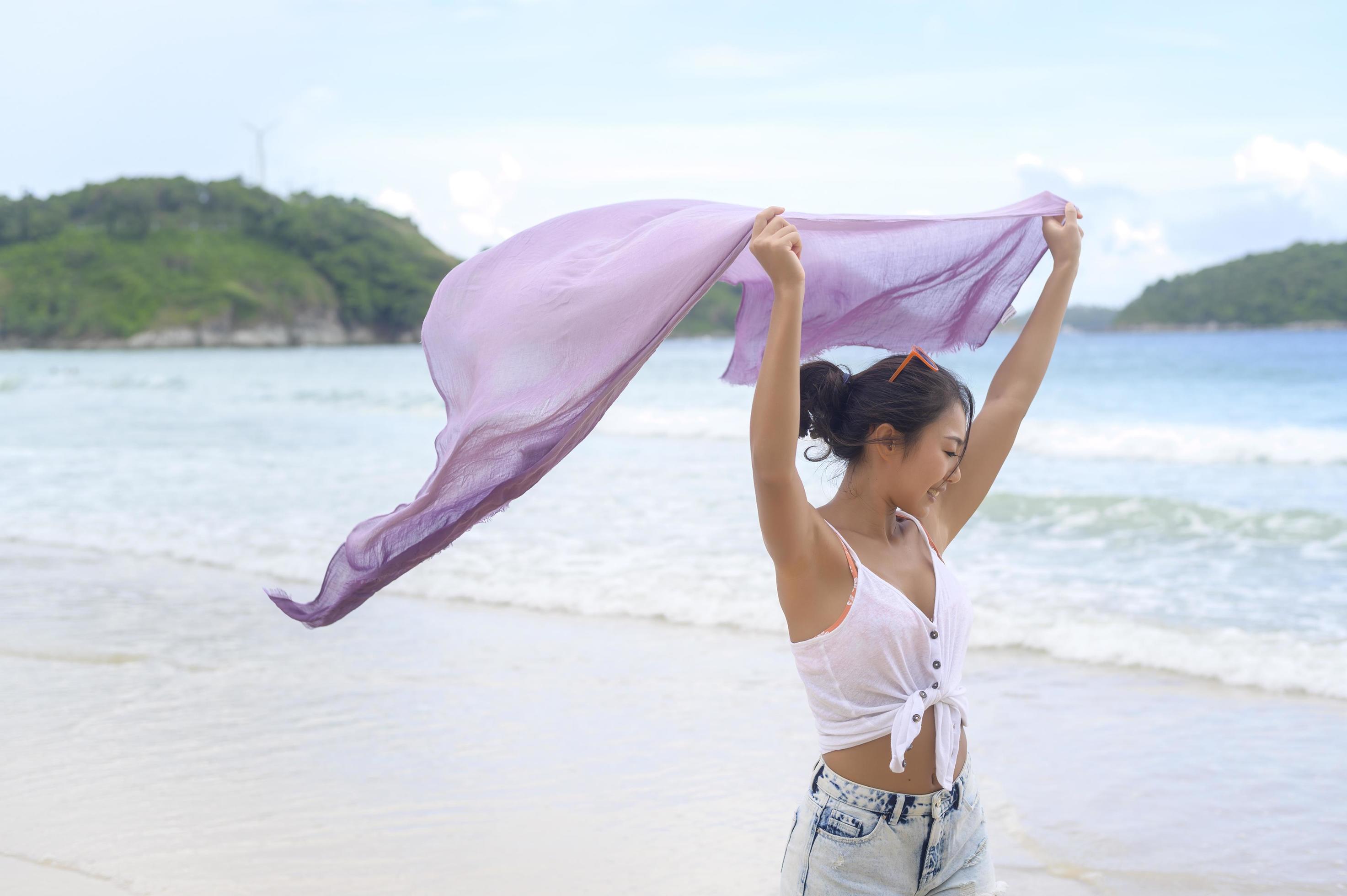 Young Beautiful woman enjoying and relaxing on the beach, Summer, vacation, holidays, Lifestyles concept. Stock Free