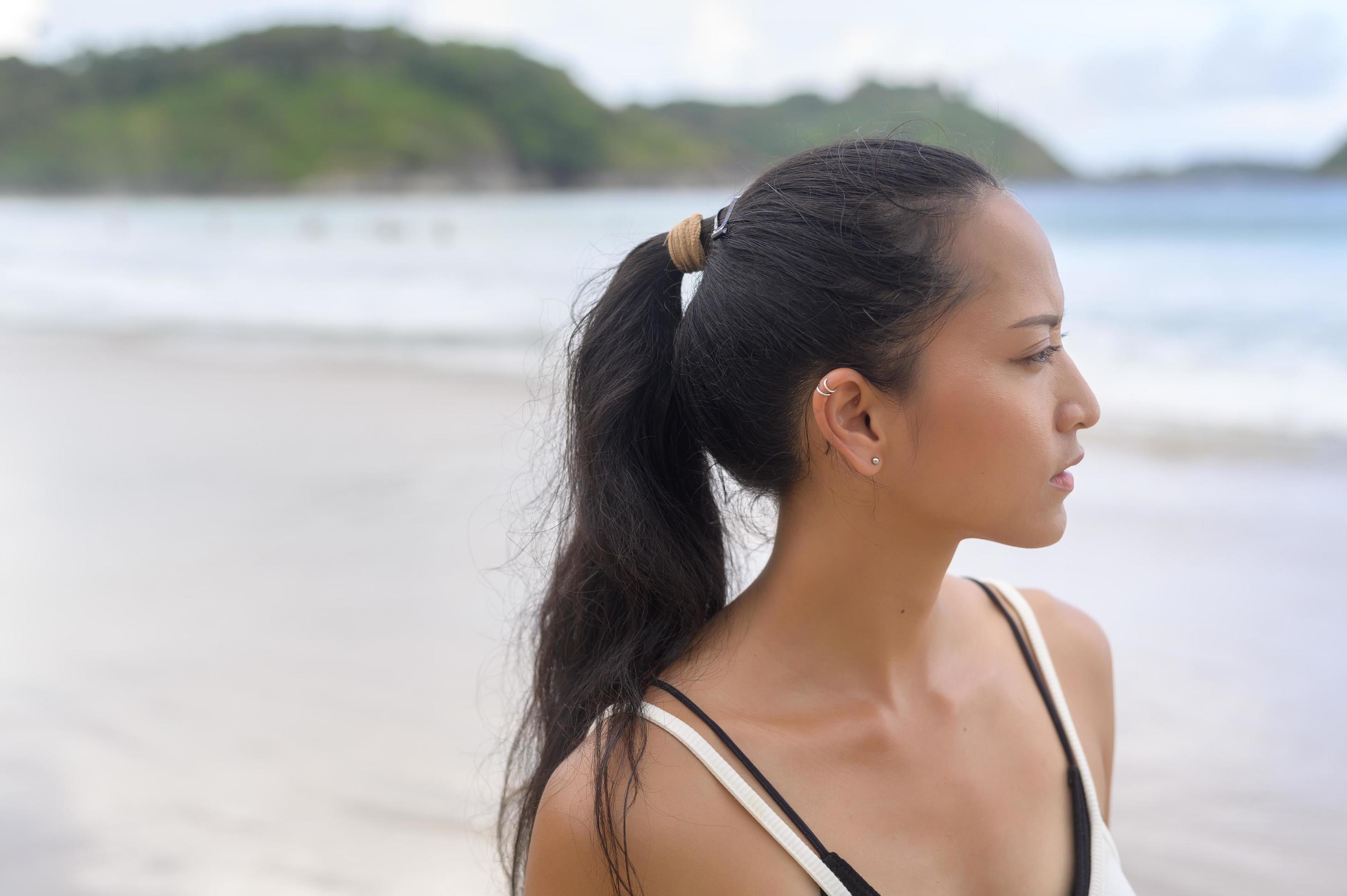 Young Beautiful woman enjoying and relaxing on the beach, Summer, vacation, holidays, Lifestyles concept. Stock Free