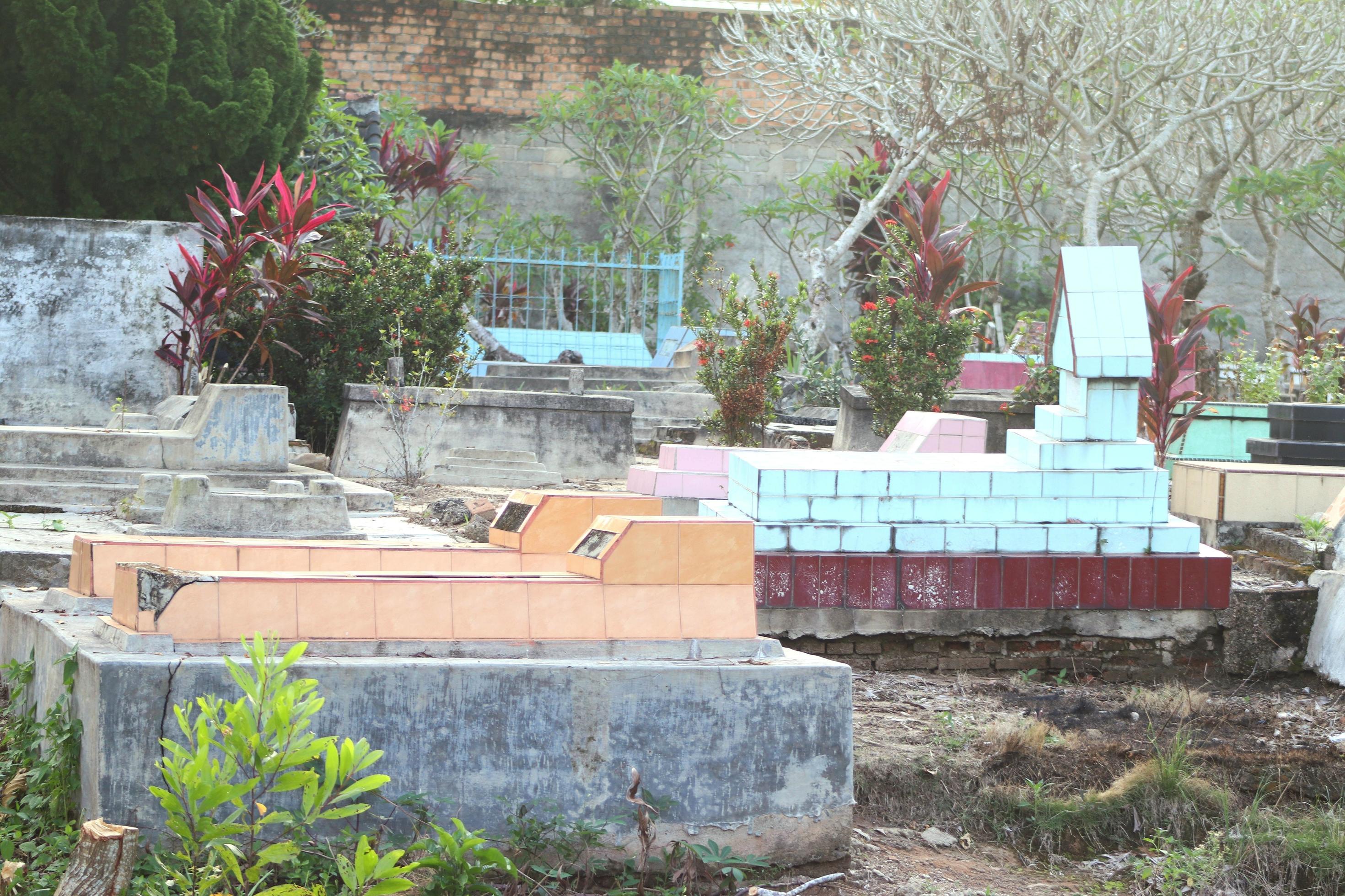 Historic place of public cemetery with natural floral background of buildings and trees Stock Free