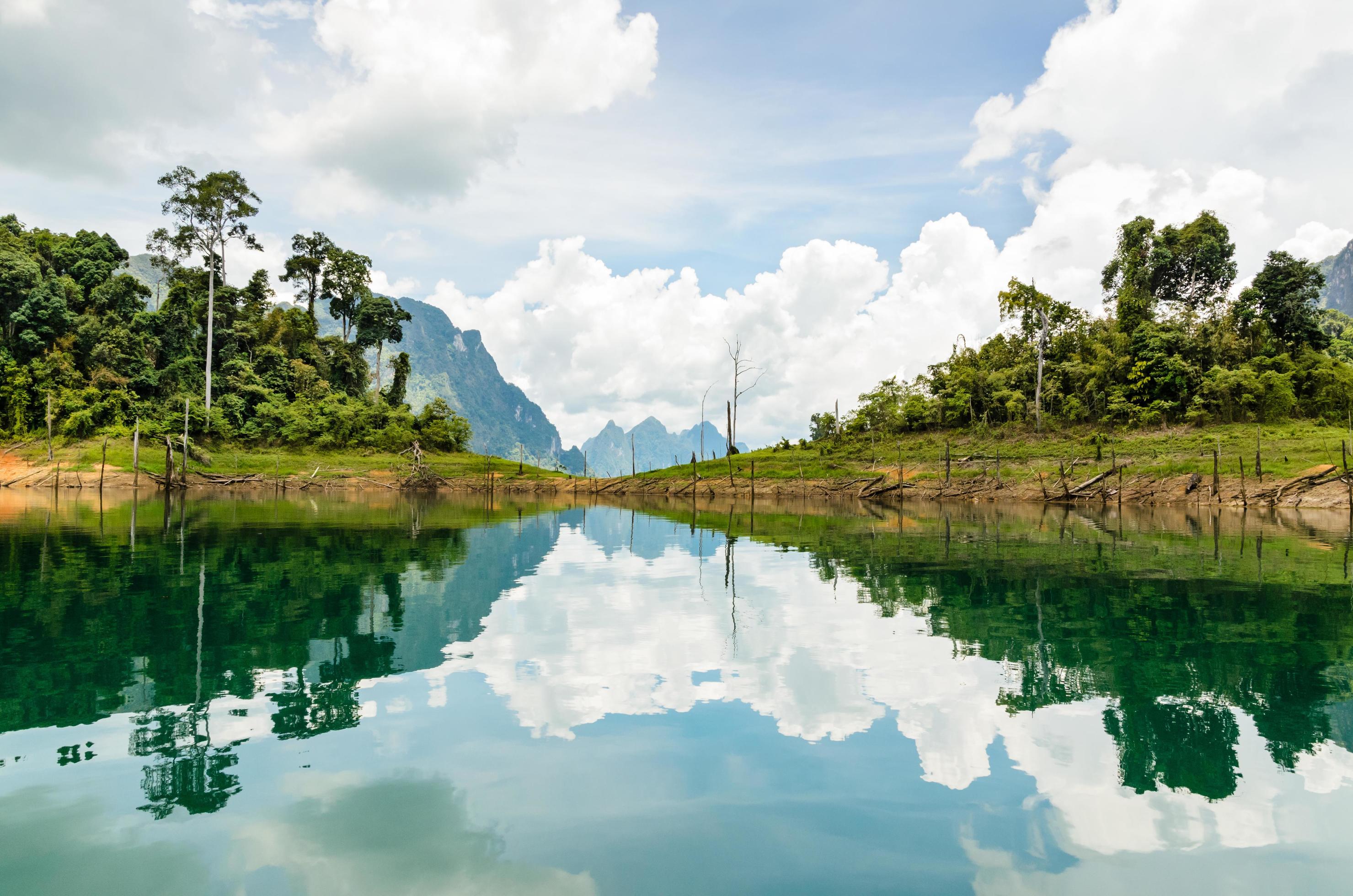 Water surface reflecting sky and cloud Stock Free