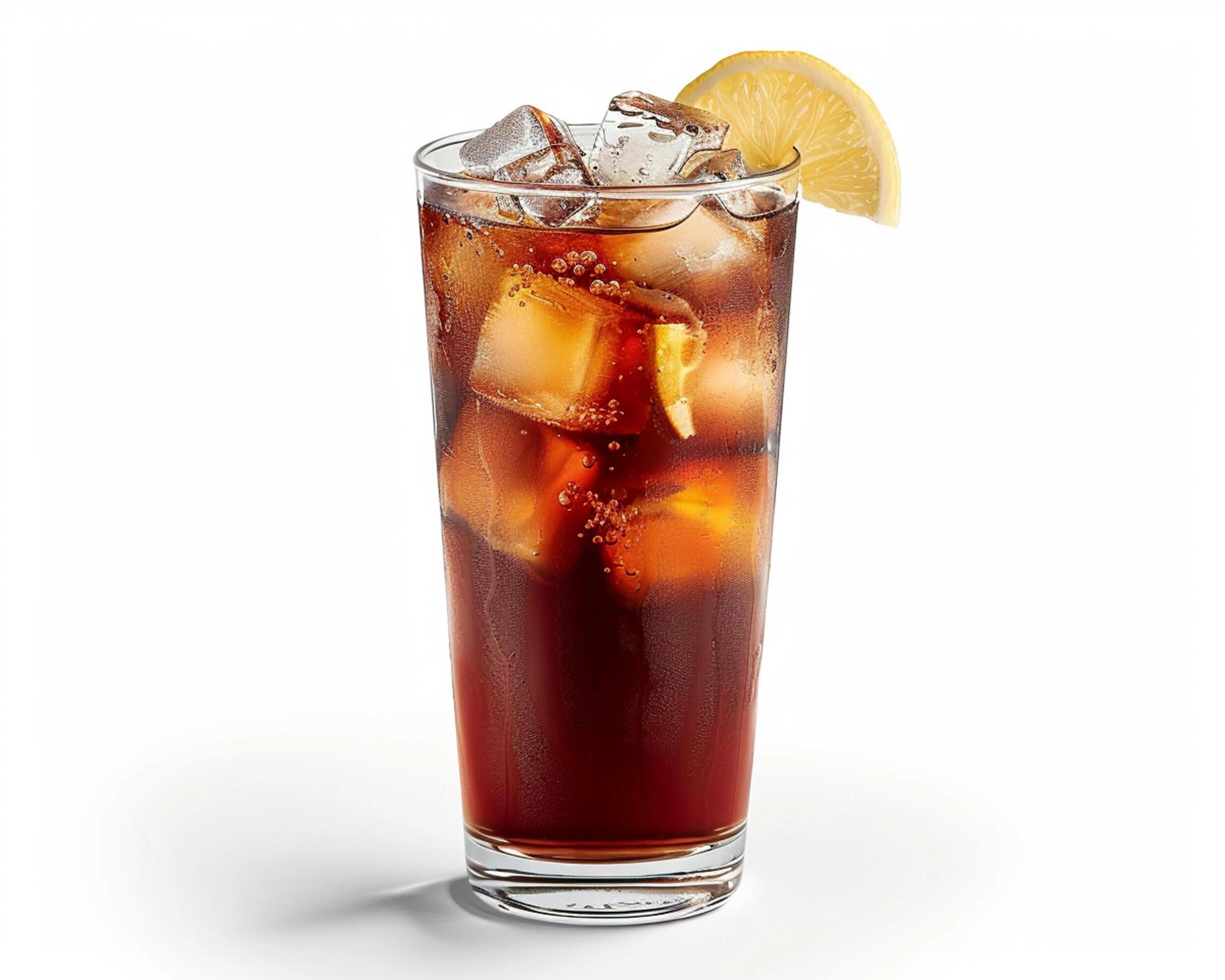 a glass of iced tea with a lemon wedge Stock Free