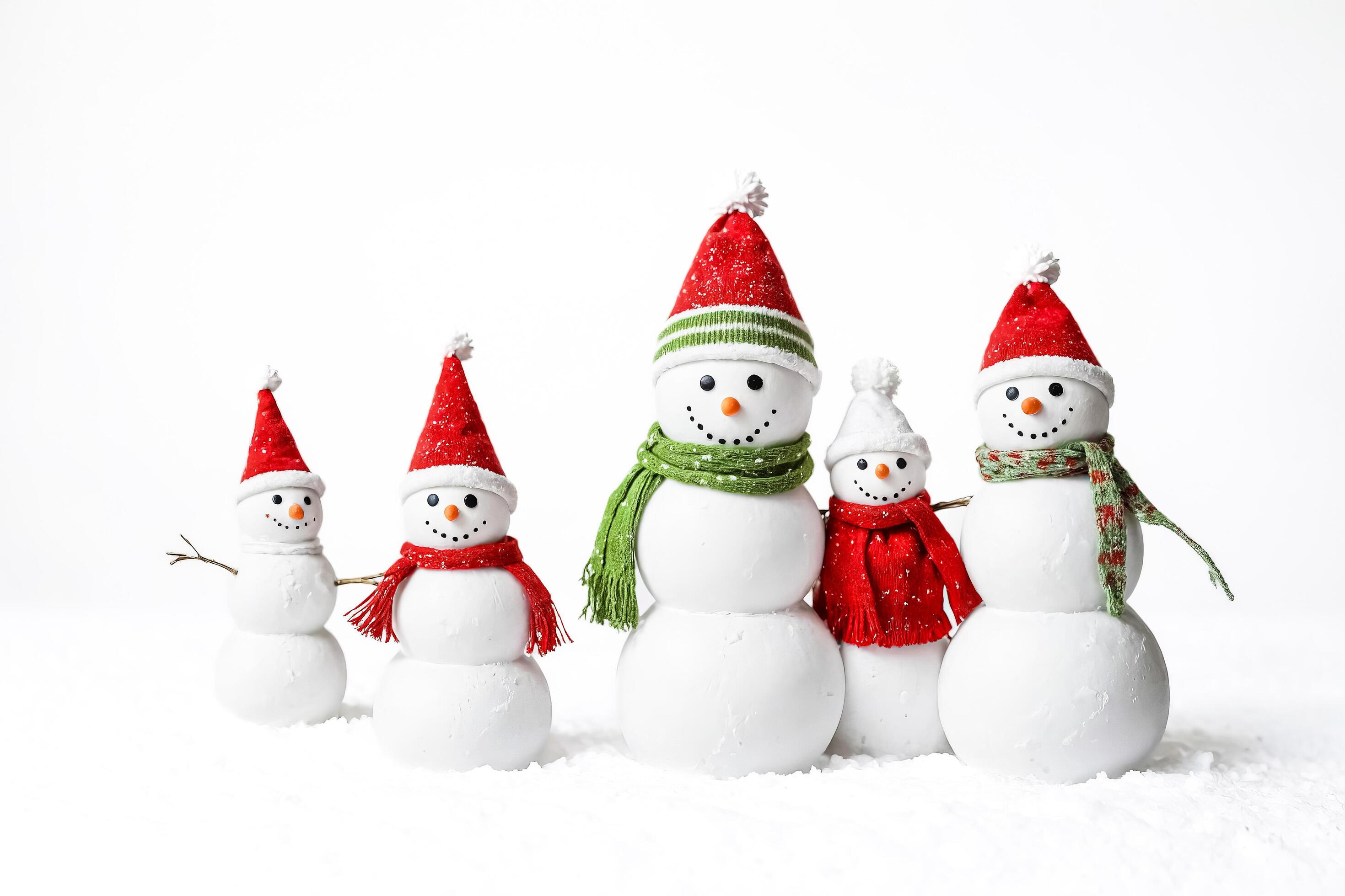 Family of snowmen in Santa hats Stock Free