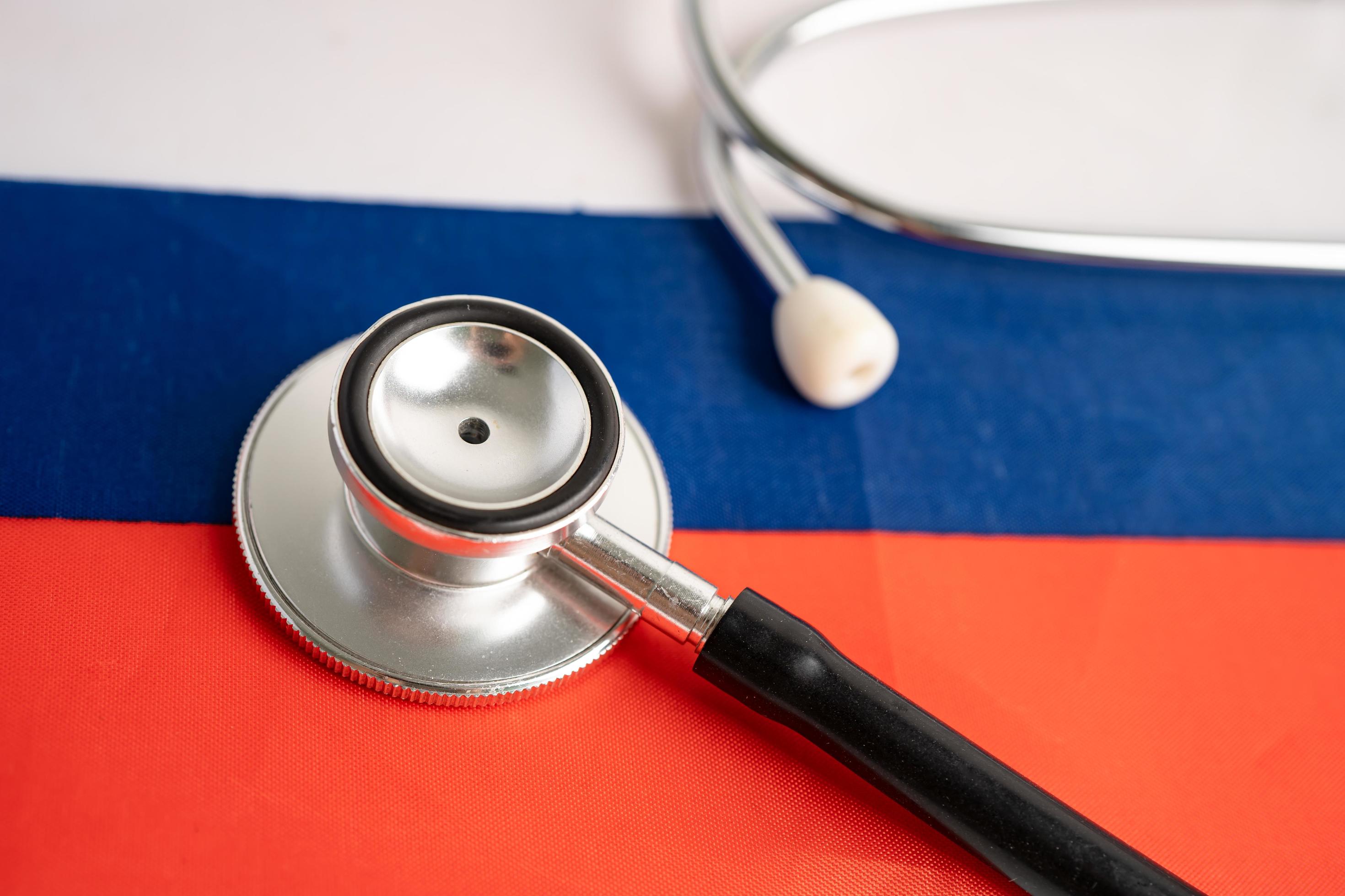 Black stethoscope on Russia flag background, Business and finance concept. Stock Free