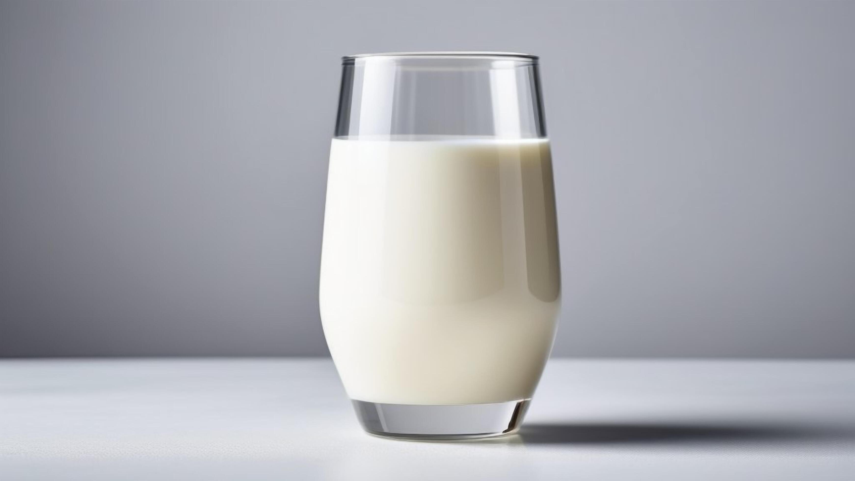 Glass of milk isolated on a white background with minimalistic style. concept of breakfast Stock Free