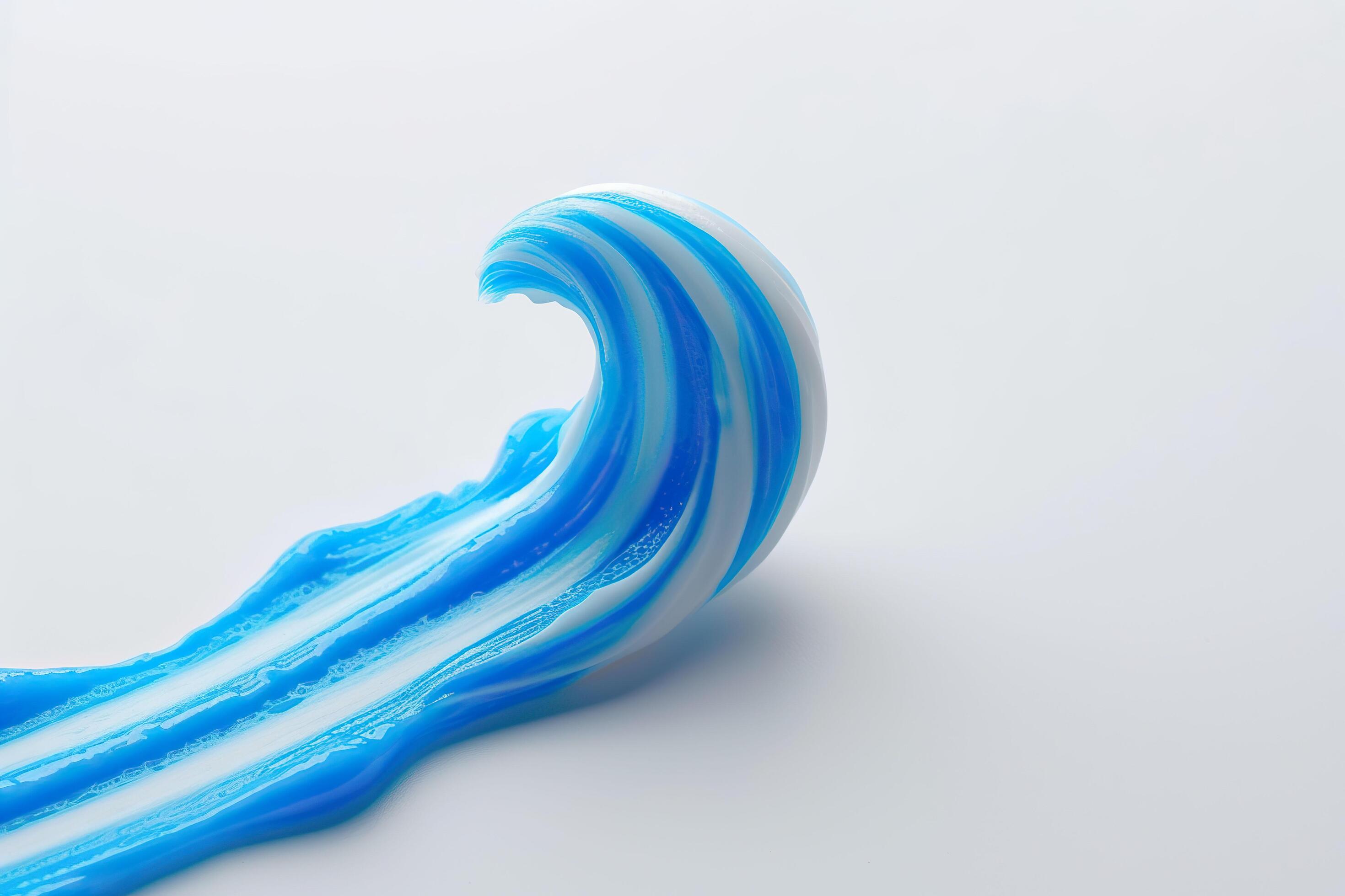 Blue toothpaste on white background. Stock Free