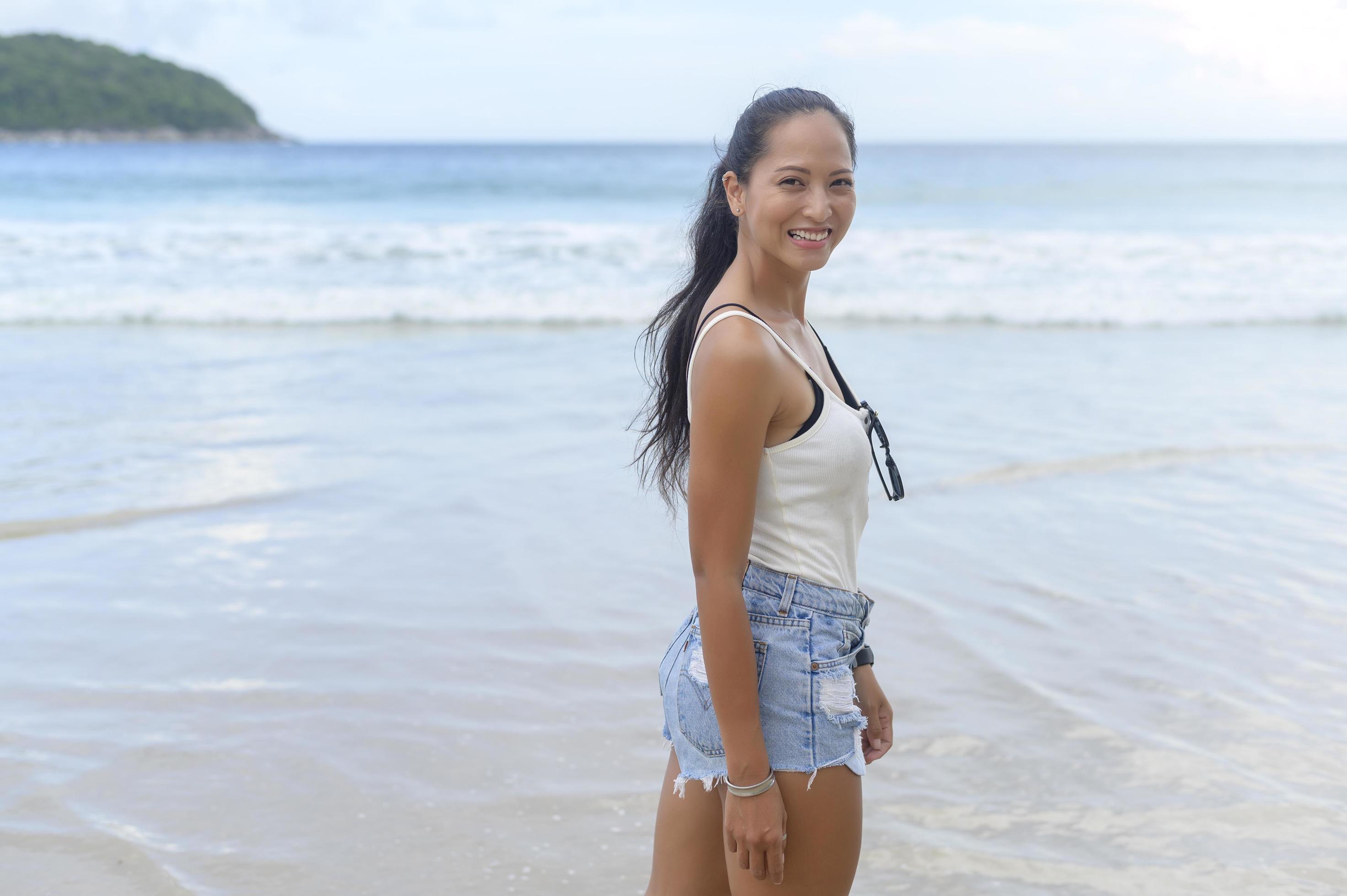 Young Beautiful woman enjoying and relaxing on the beach, Summer, vacation, holidays, Lifestyles concept. Stock Free