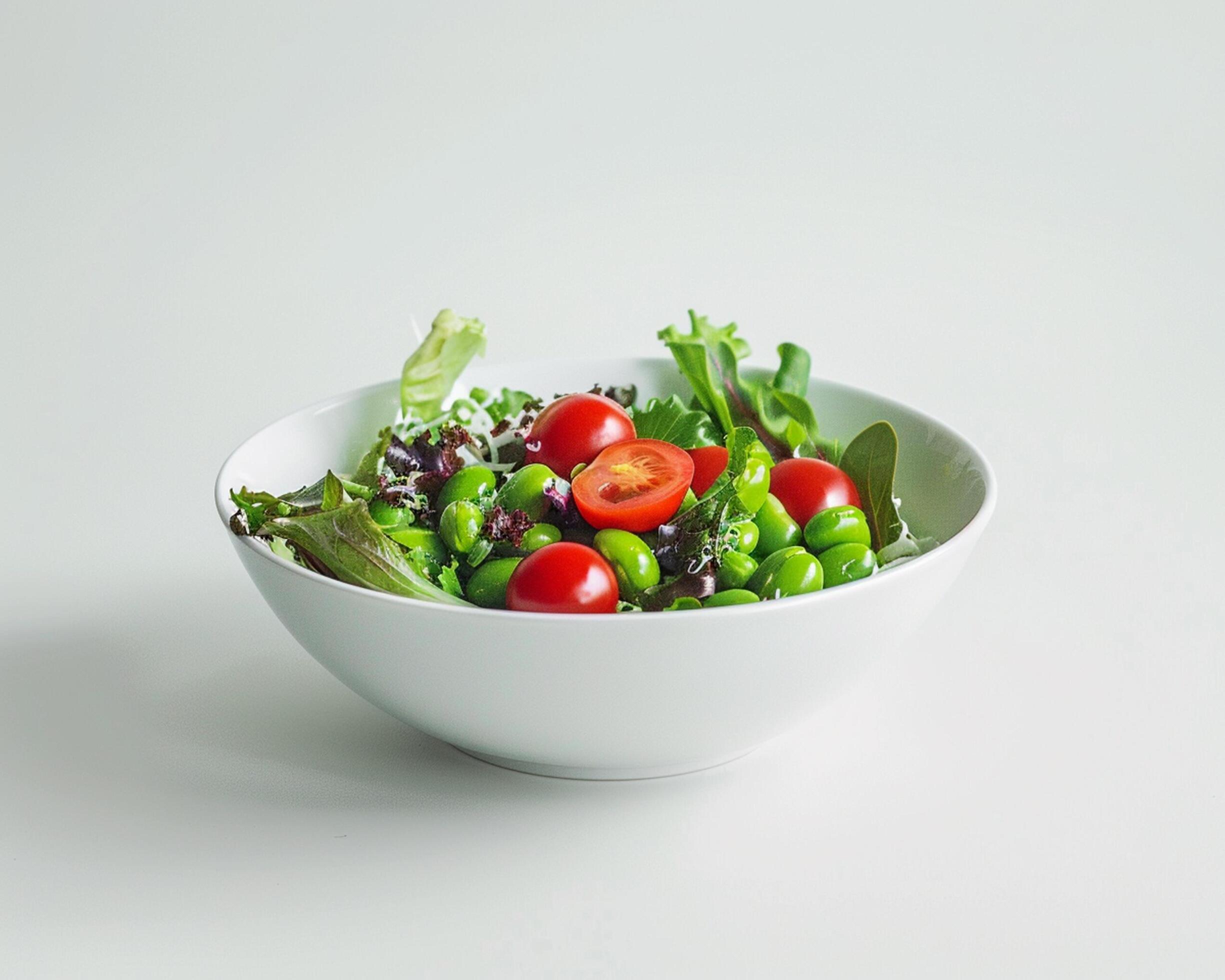 
									a white bowl filled with a salad of vegetables Stock Free