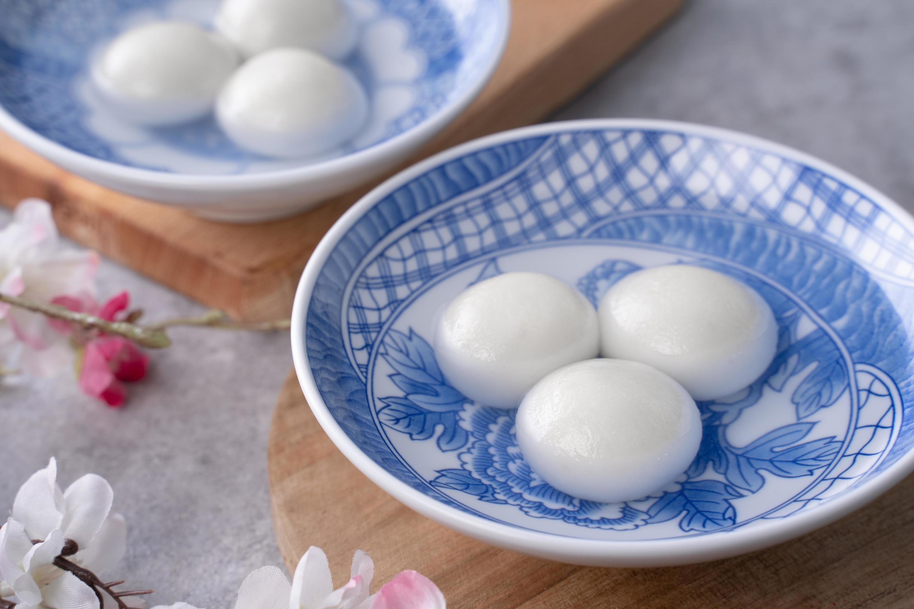 Close up of tangyuan in a bowl on gray table, food for Winter Solstice. Stock Free