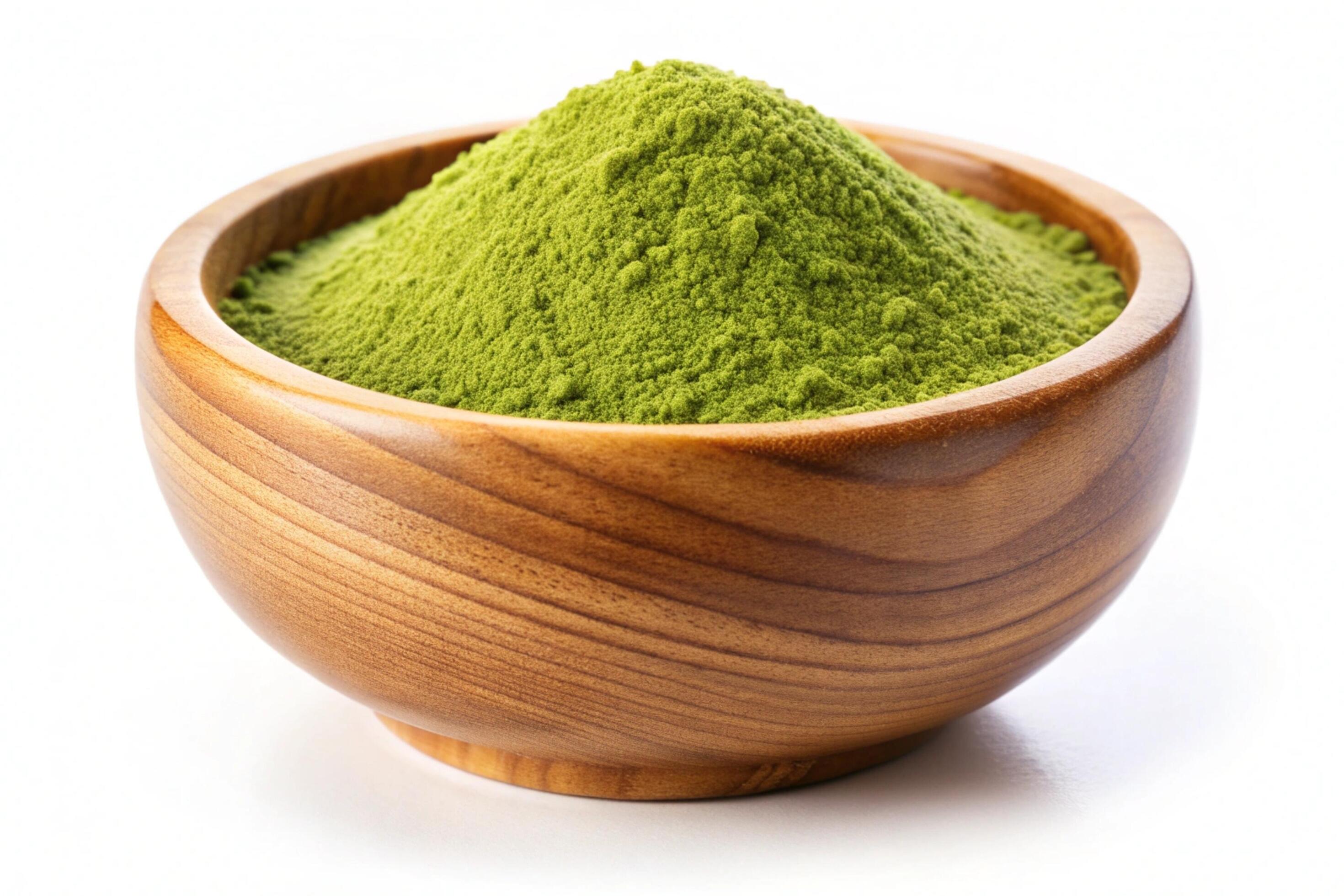 Instant green tea powder in wood bowl isolated on white background Stock Free