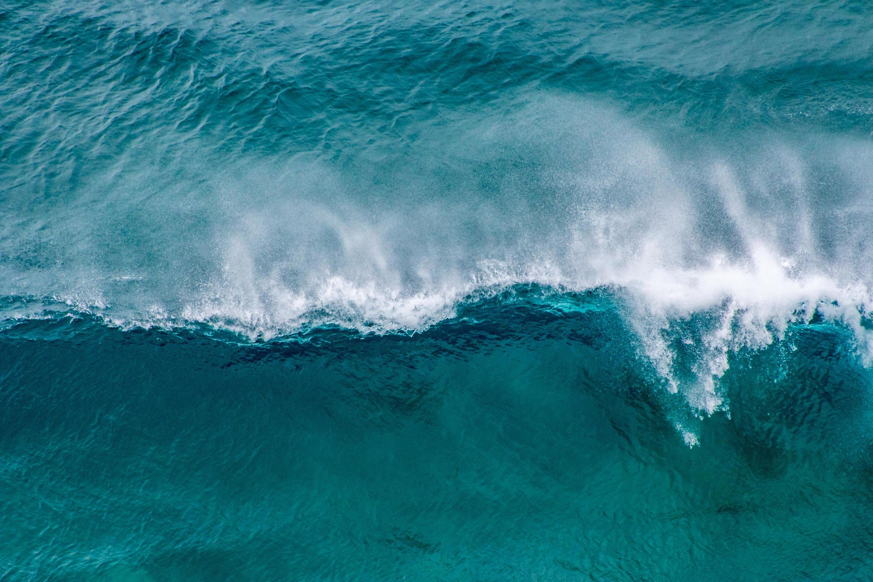 Aerial view of blue ocean waves Stock Free