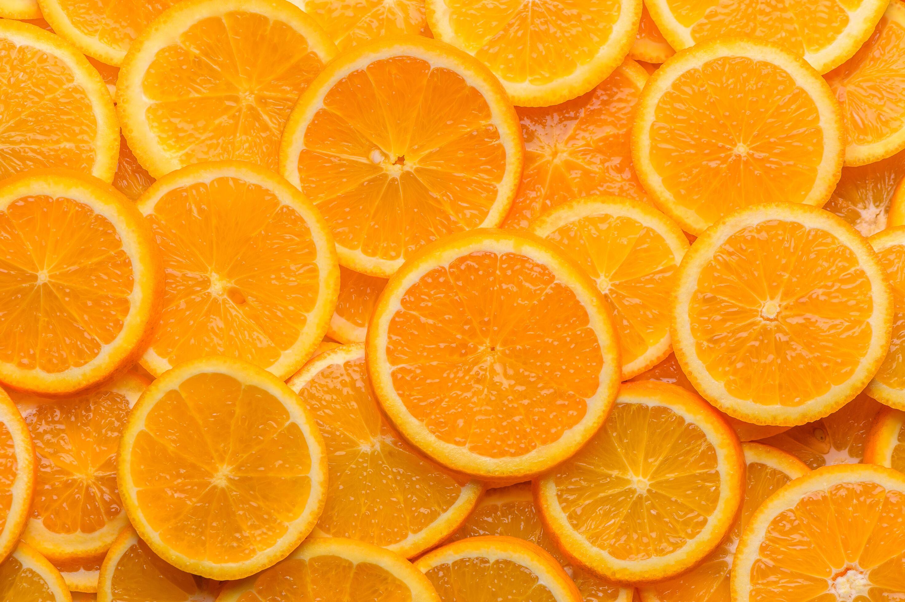 oranges cut into slices and laid out on the table as a food background 3 Stock Free