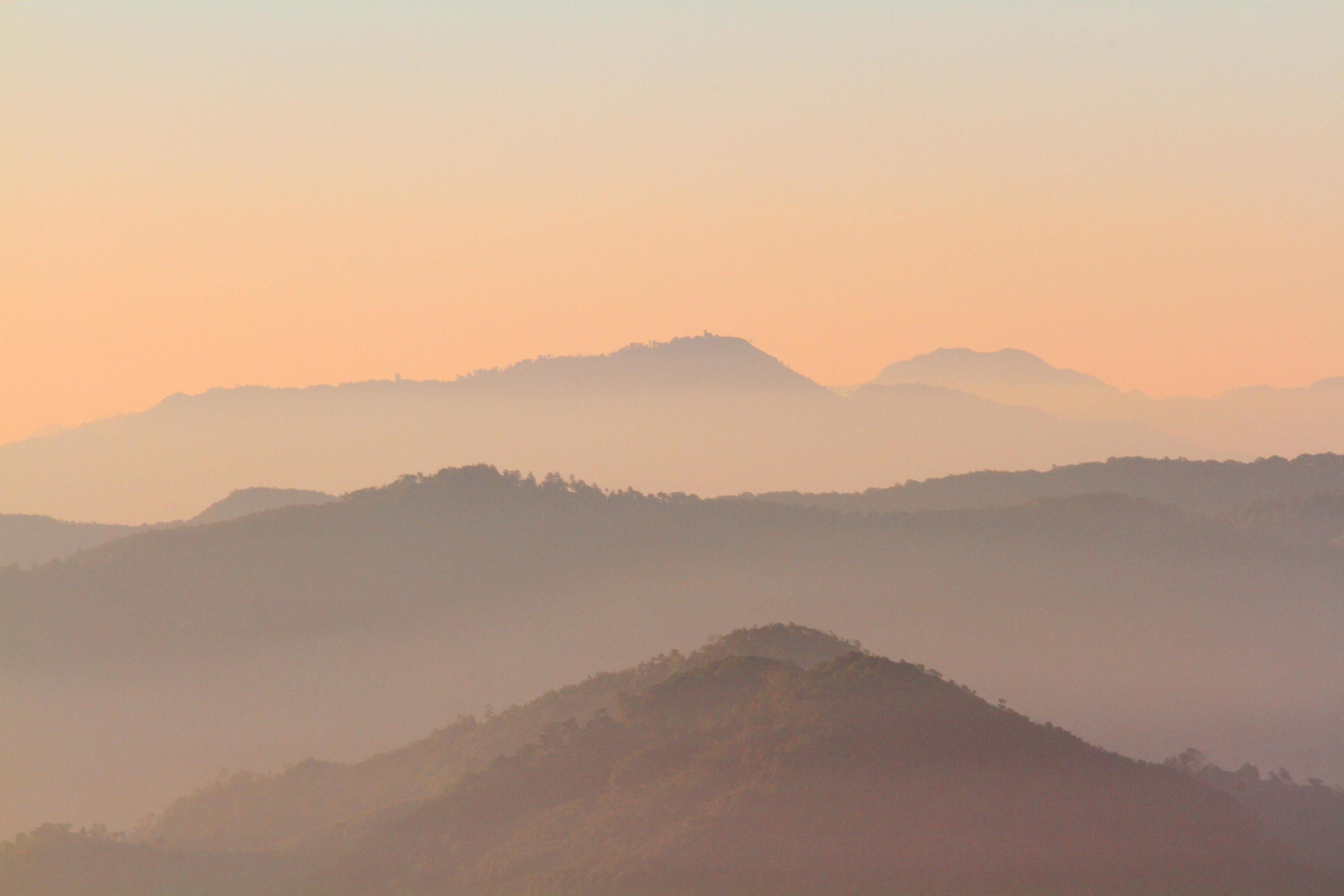 Beautiful Sunset and sunrise on sky and golden twilight time with mist and fog in valley of mountain layer Stock Free