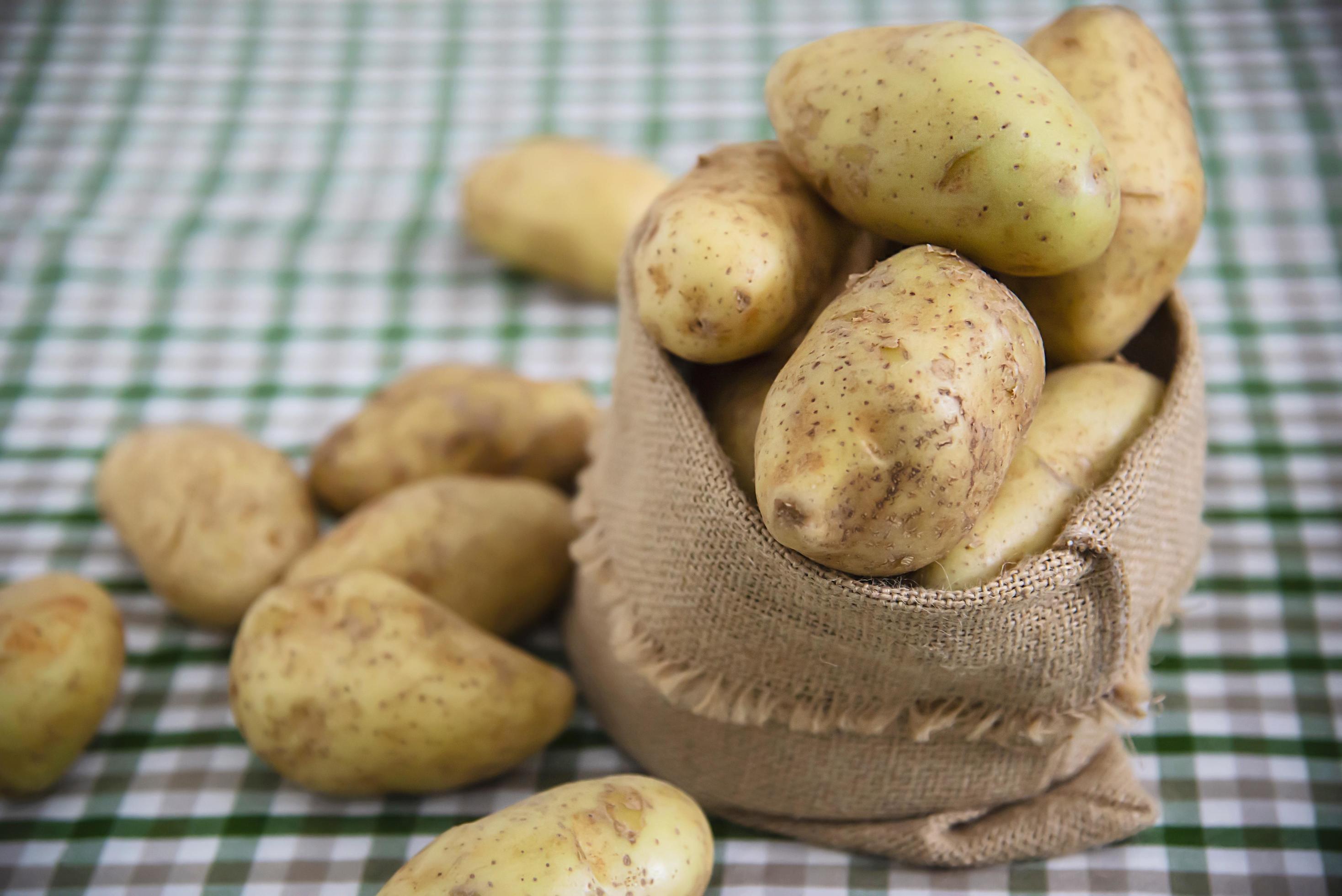 Fresh potato in kitchen ready to be cooked – fresh vegetable preparing for making food concept Stock Free