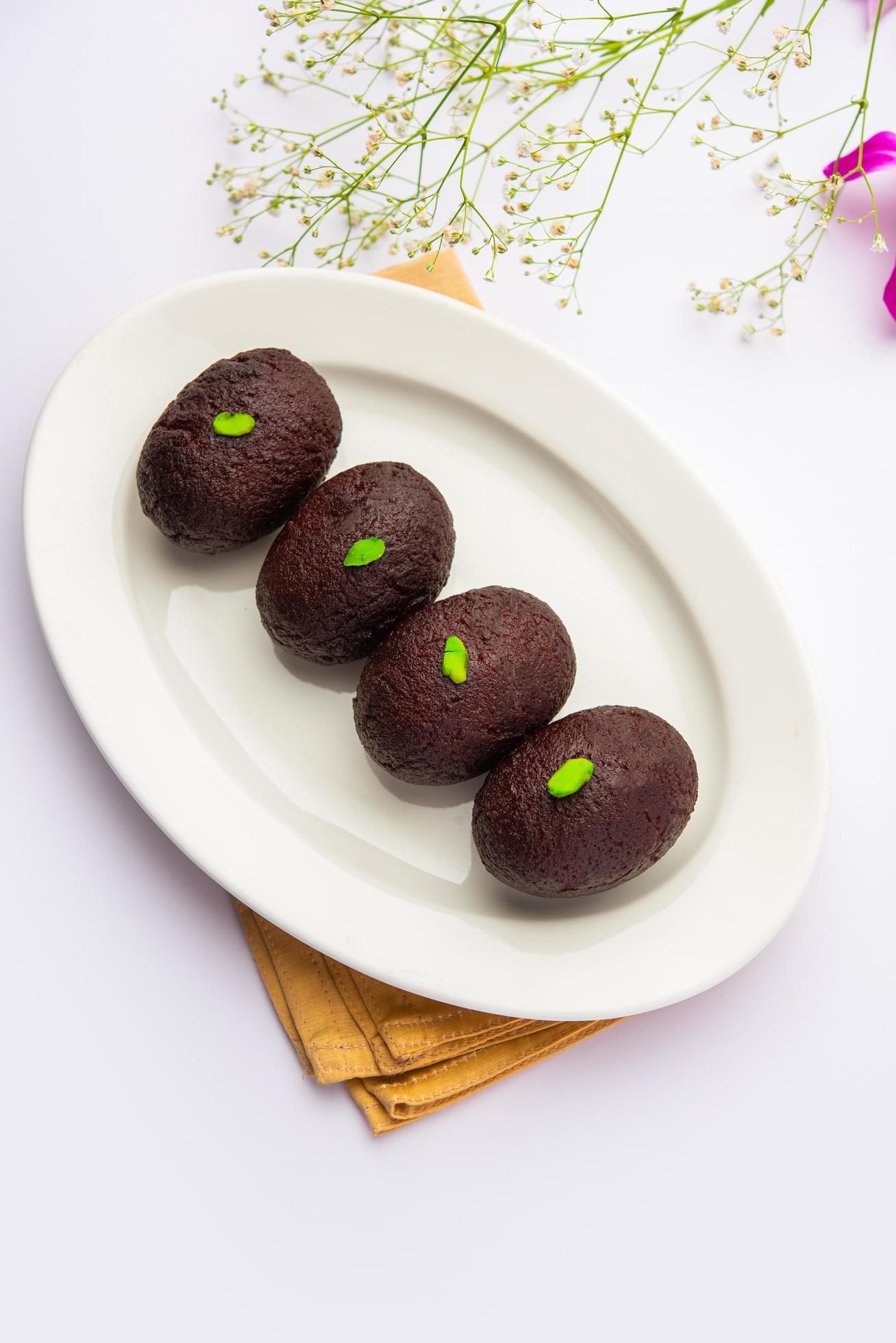 Indian Sweet Food Sweet Black Gulab Jamun Also Known as Kala Jamun, Black Jamun or Dry Kala Jam Stock Free