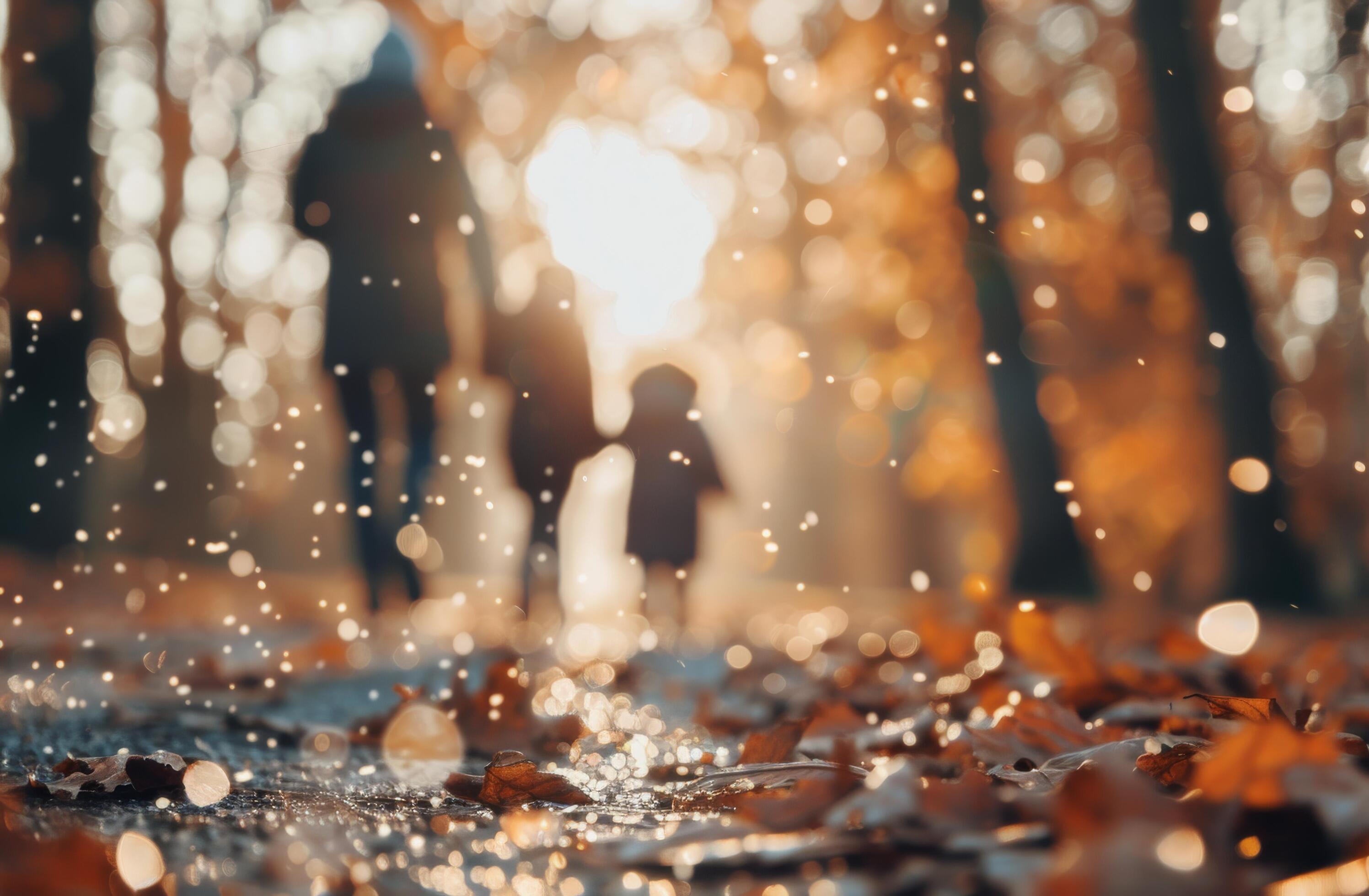 Family Walking Through Autumn Leaves in a Sunlit Park During Golden Hour Stock Free