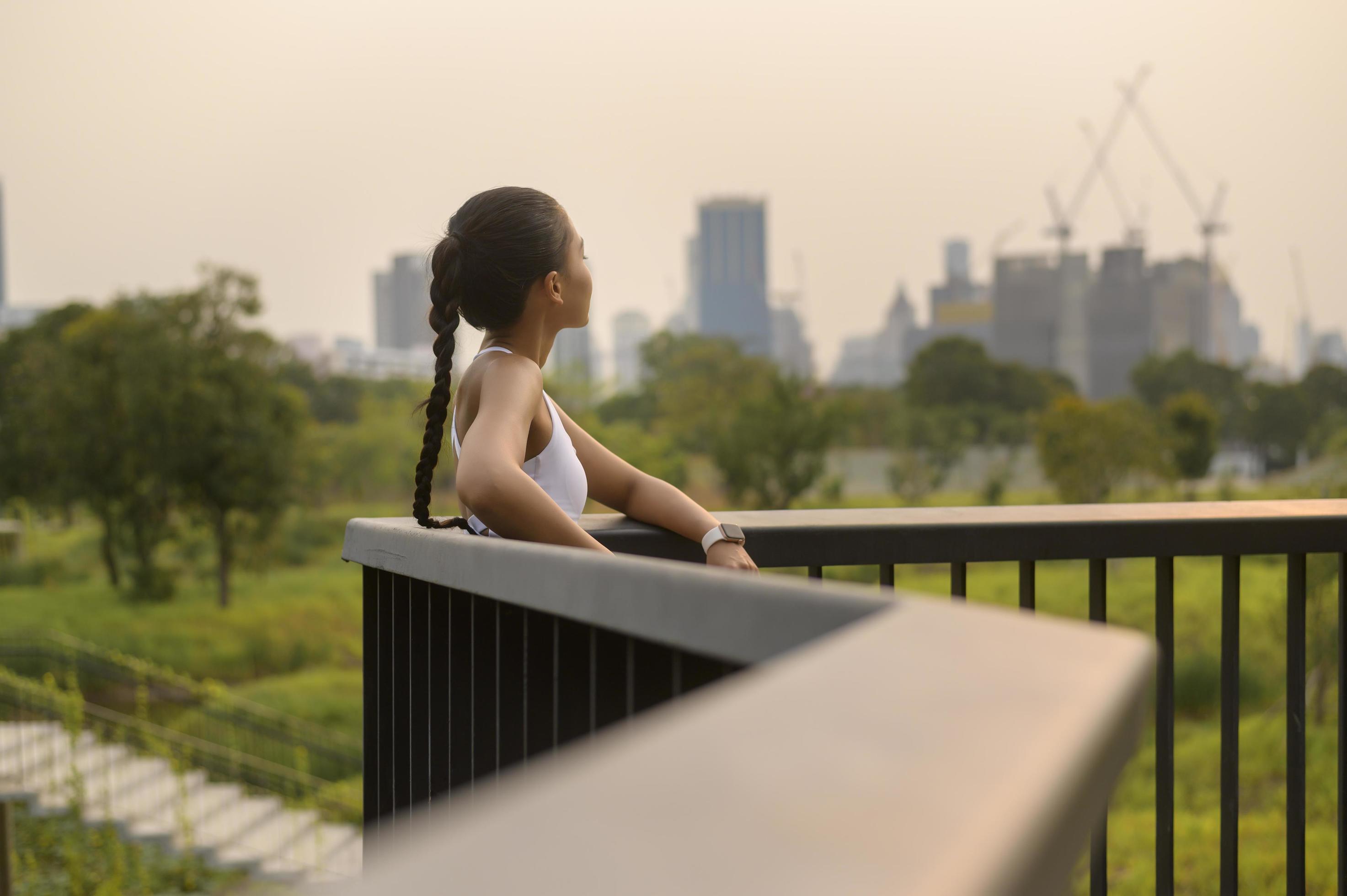 Portrait of young fitness woman in sportswear in city park, Healthy and Lifestyles. Stock Free