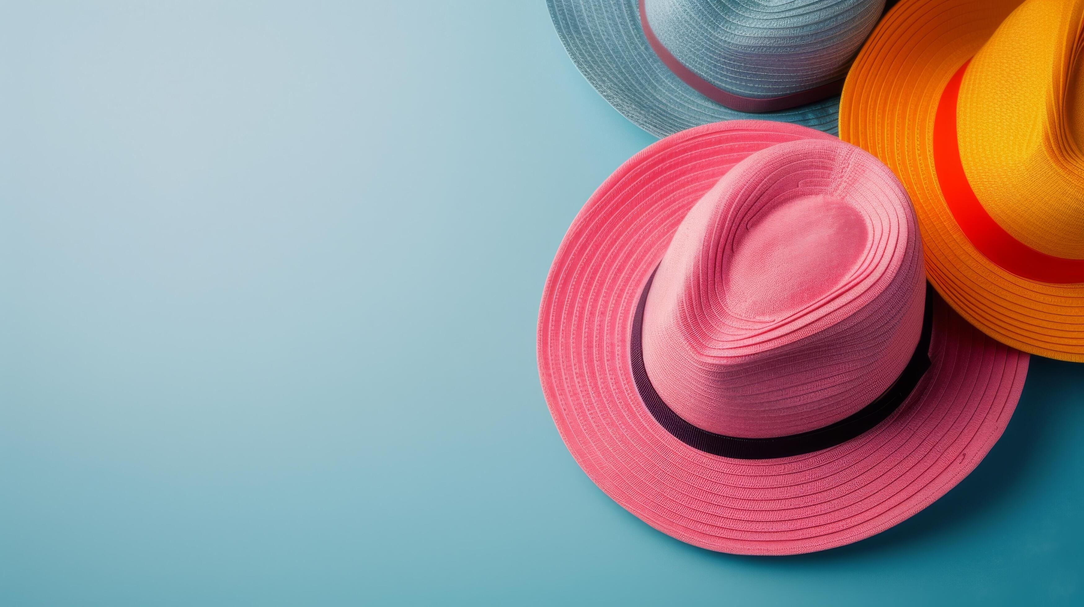 Colorful Straw Hats Arranged Neatly on a Blue Background Stock Free