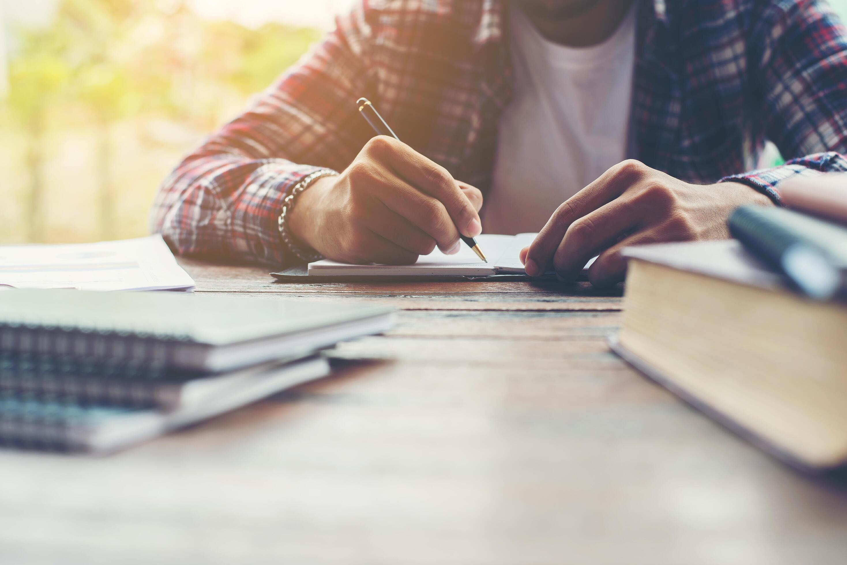 Hipster Businessman Working writing Determine Workspace Lifestyle Concept. Stock Free