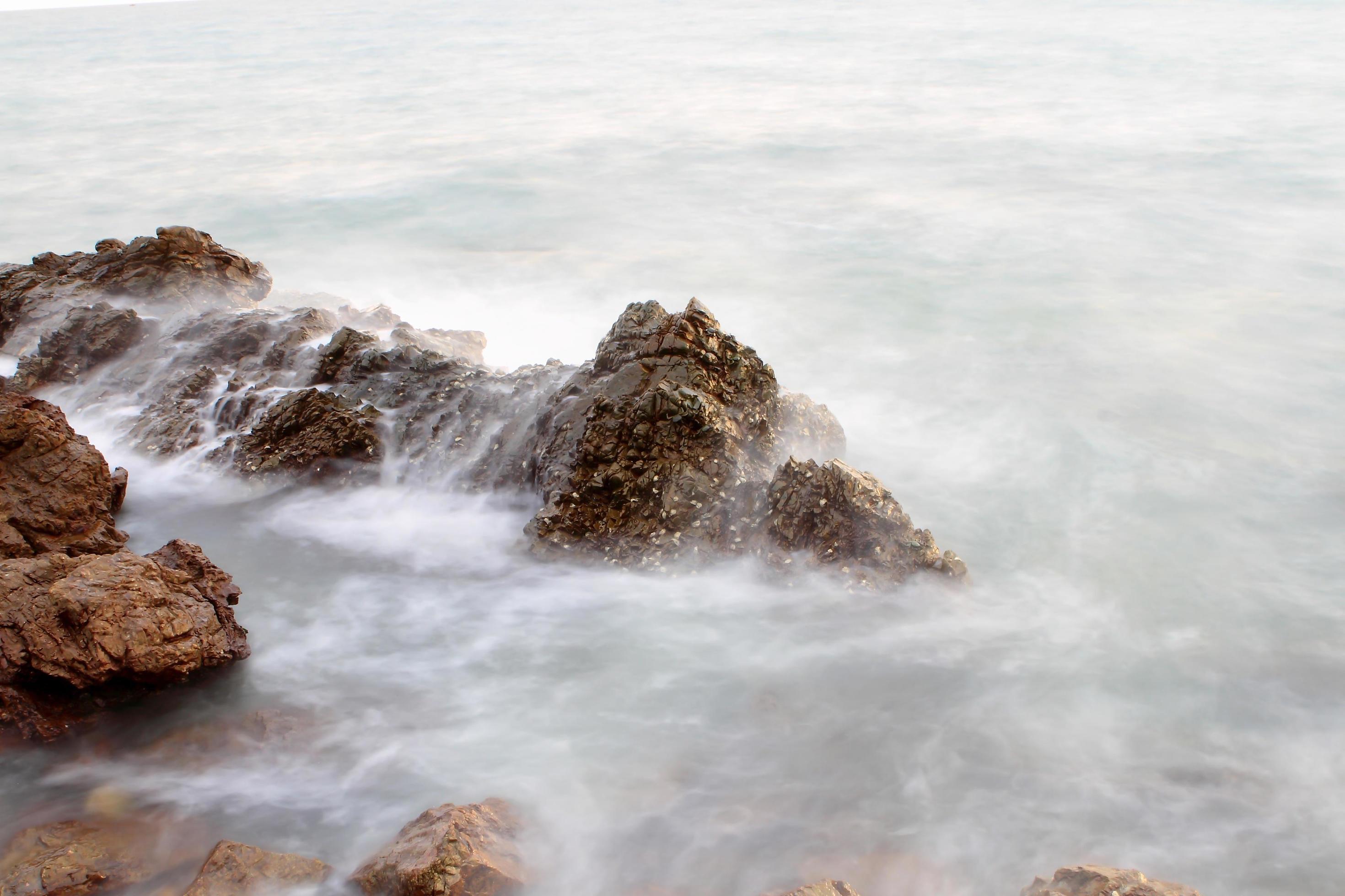 Beautiful seascape. Sea and rock at the sunset Stock Free