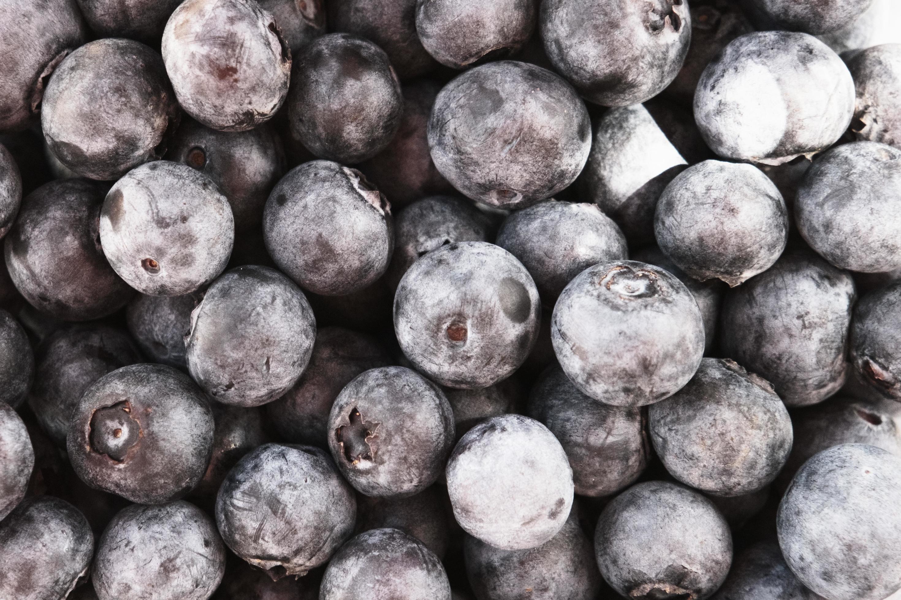 diet natural blueberries in the basket, top view, ripe blue berries on the market stall, group of purple eco berry, organic nutrition, food background Stock Free