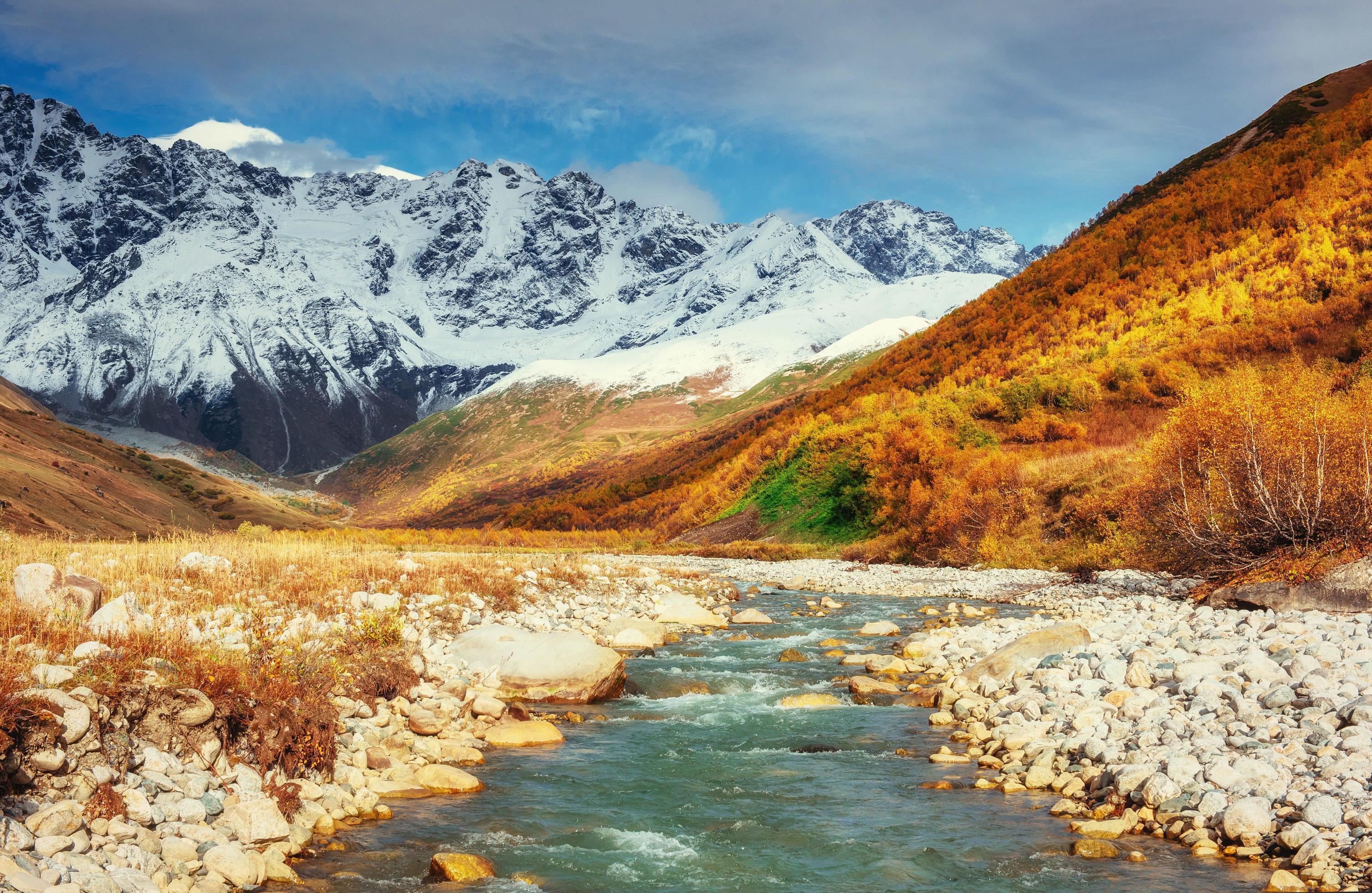 Snowy mountains and noisy mountain river. Georgia, Svaneti. Euro Stock Free