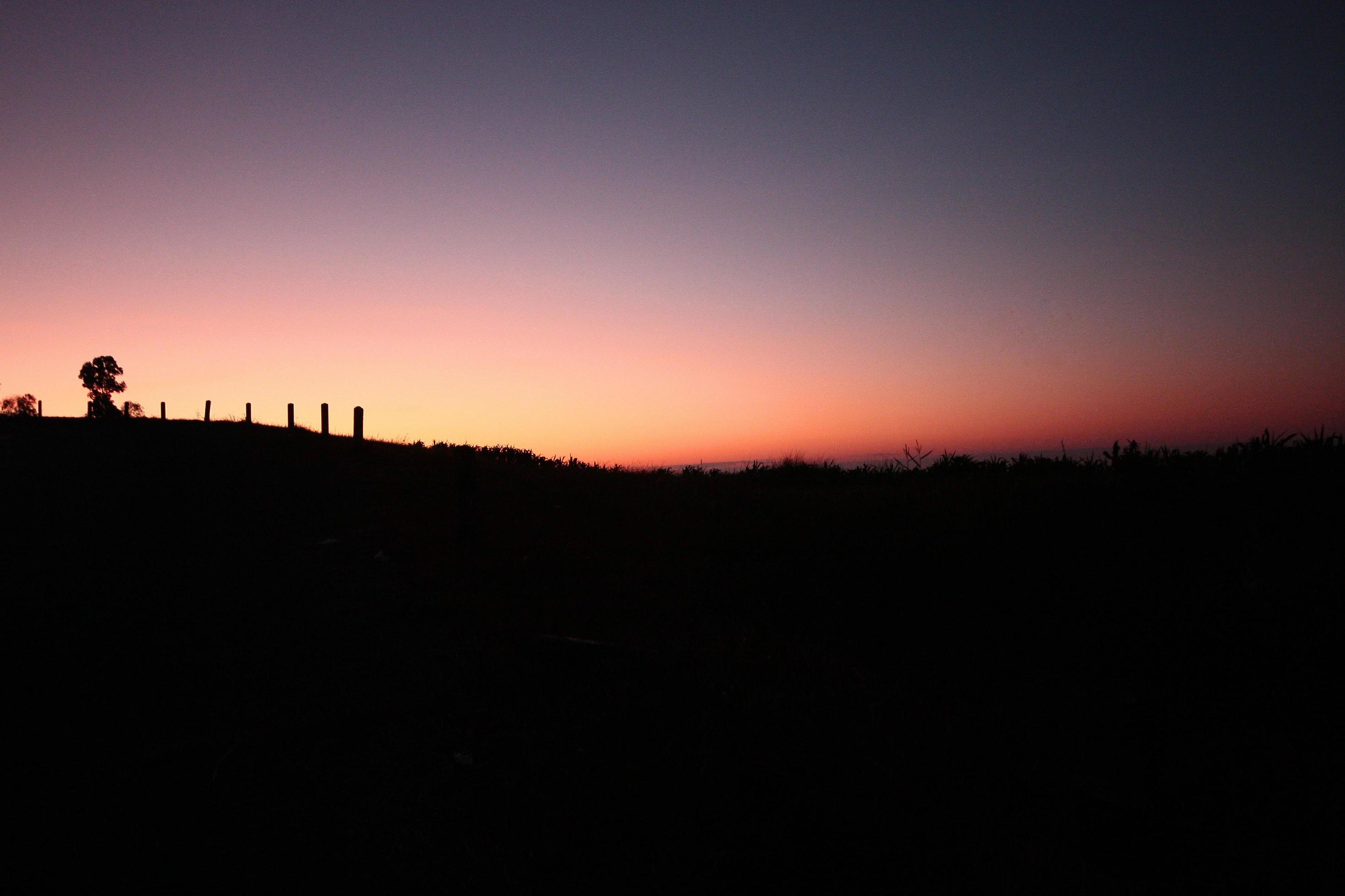 Beautiful silhouette of moments in natural sunrise and sunset on the mountain. Peace, loneliness and Haloween Concept. Stock Free