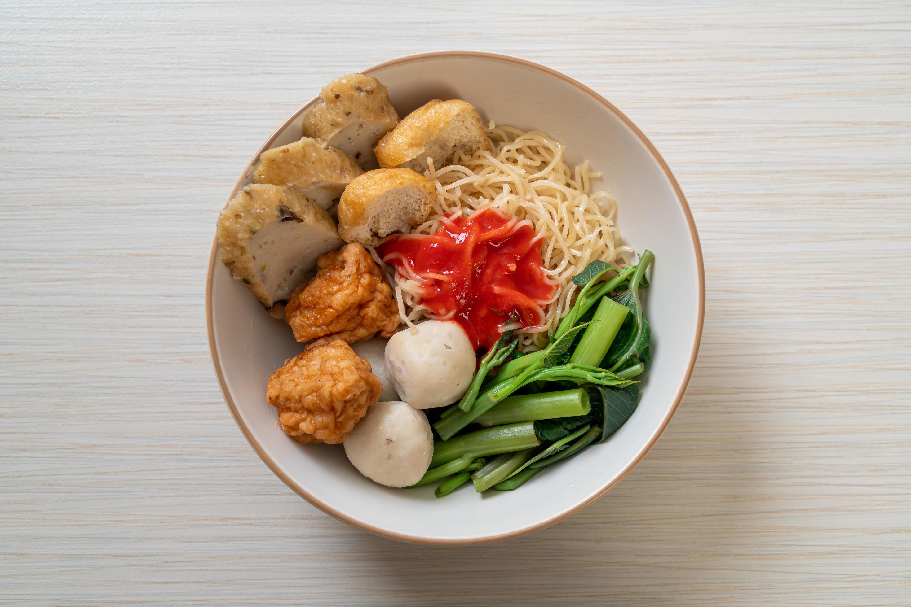 Egg noodles with fish balls and shrimp balls in pink sauce, Yen Ta Four or Yen Ta Fo – Asian food style Stock Free