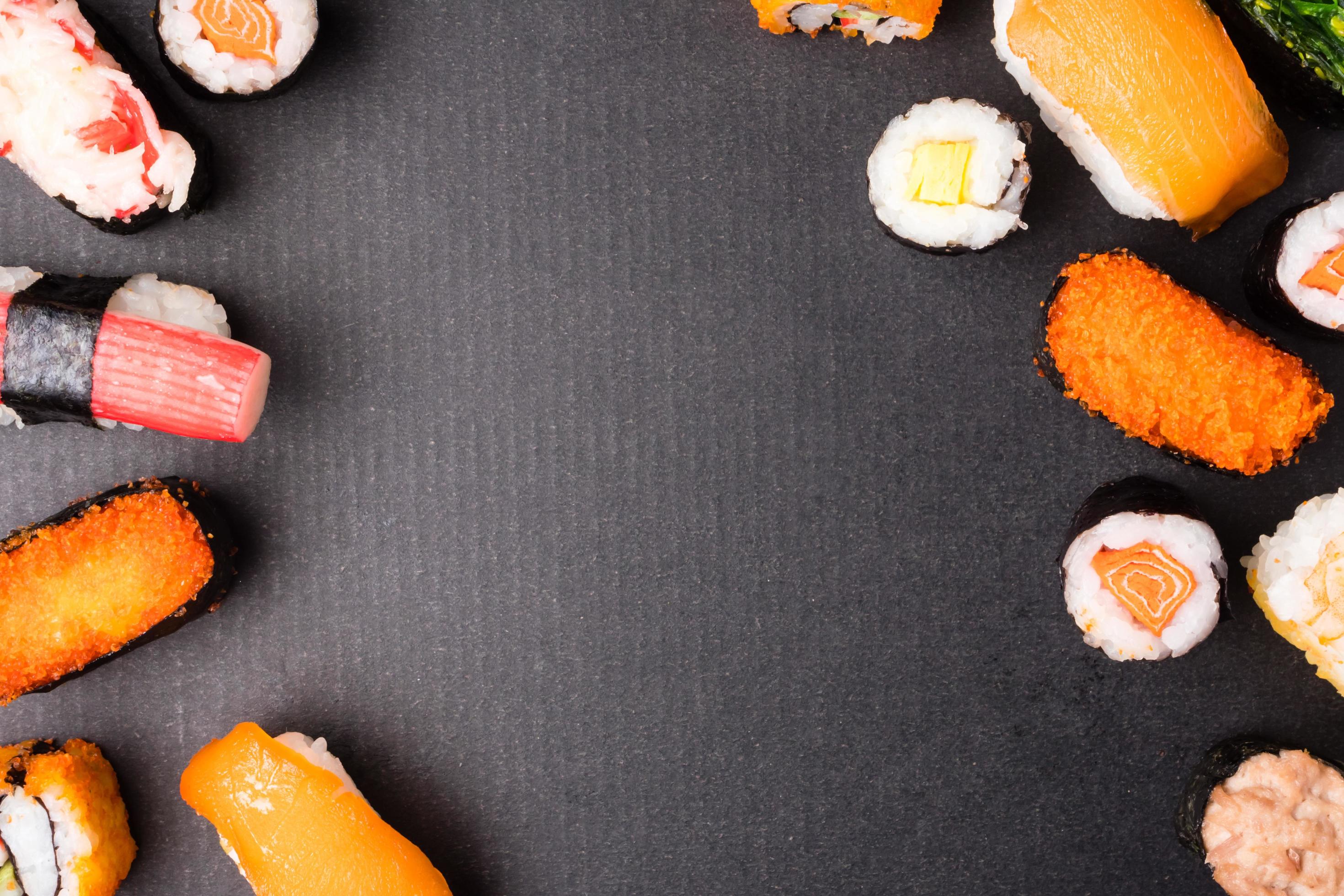 Top view of Sushi set on black background, Japanese food. Free space for text Stock Free