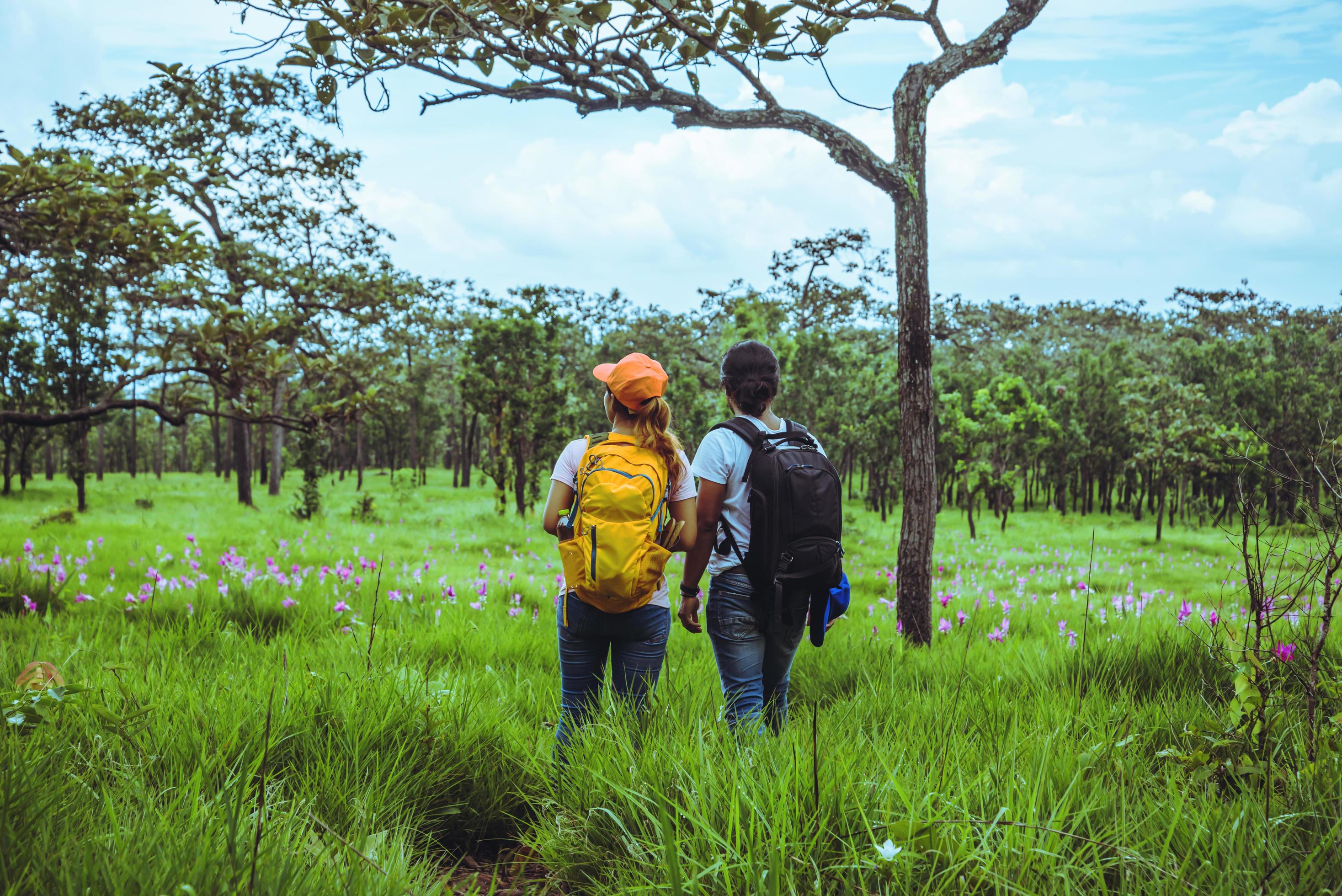 Lover woman and men Asian travel nature. Travel relax. Photography Cucumber sessilis flower field. Stock Free