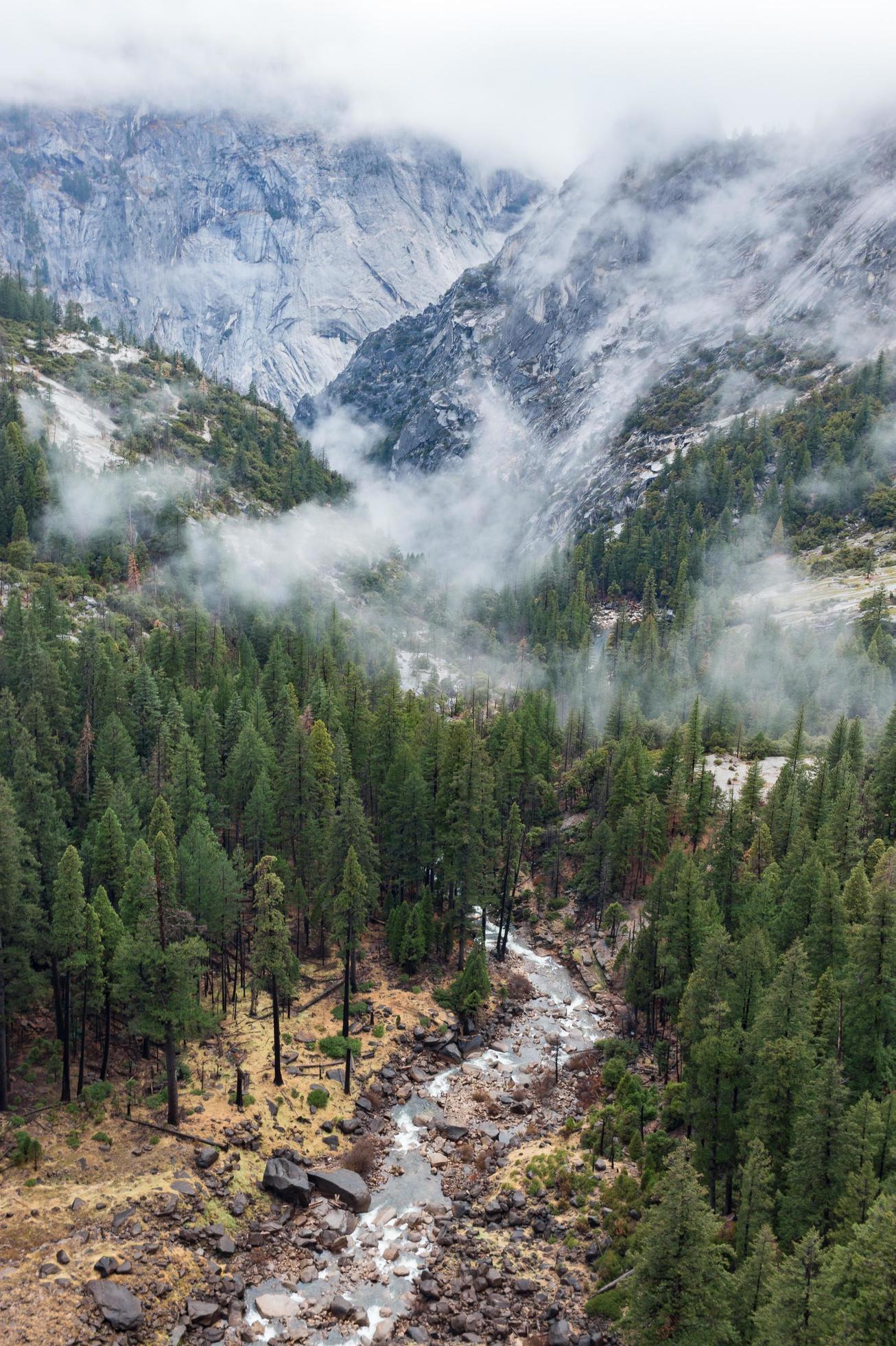 Natural spring flowing through mountains Stock Free