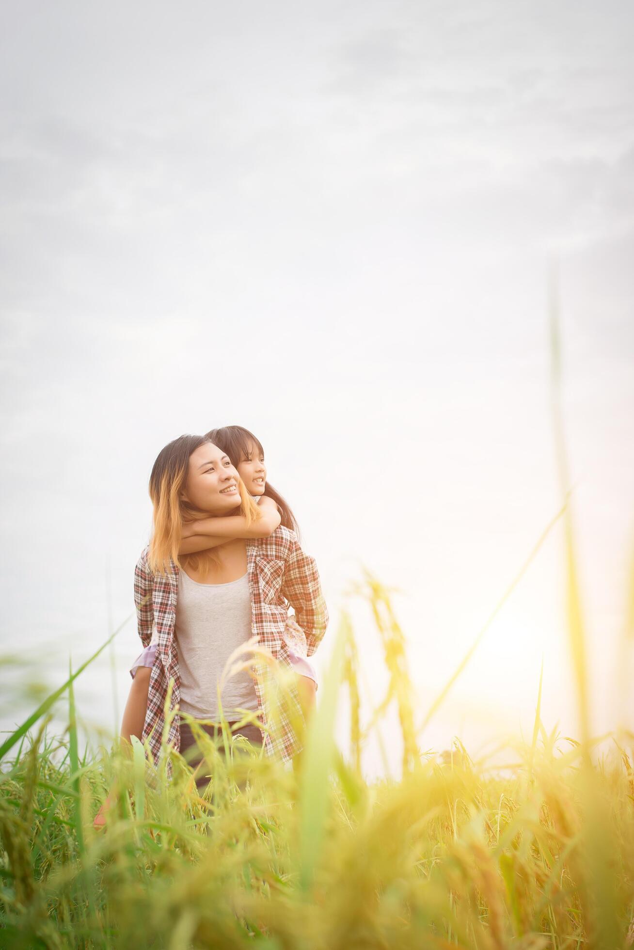 Portrait mom and daughter playing outdoor, enjoying family time. Stock Free